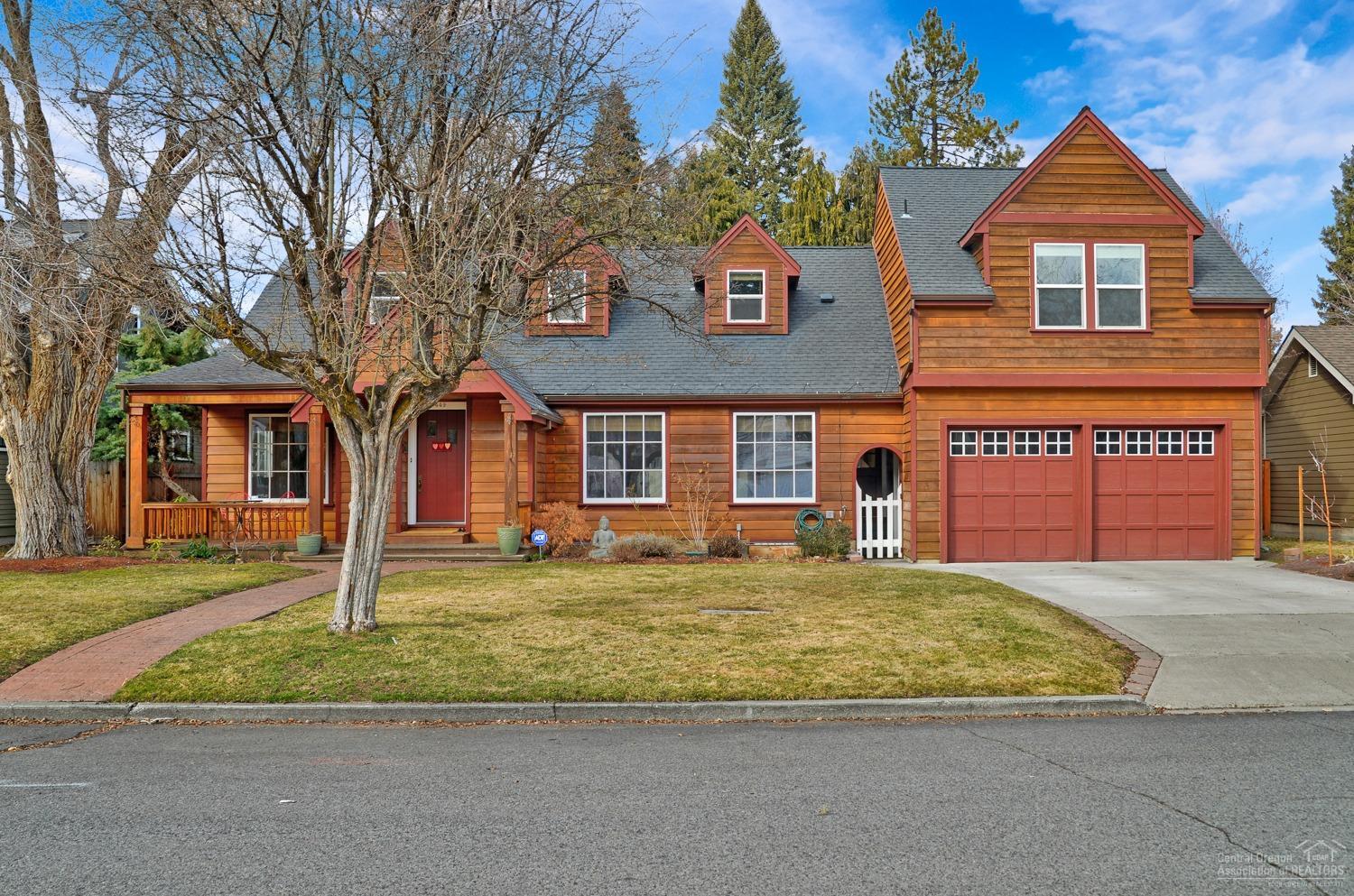 This quintessential Drake Park home is the perfect fusion of historic charm and NW Bend character on a .21 ac fenced lot one block off the Deschutes River - walk with your paddle board from the 'take out', stroll to 10 Barrel, or meander downtown. Three levels flow beautifully offering a flexible and spacious floor plan. A wood burning fireplace graces the living room and opens to the dining area with built-in bar, beverage refrigerator and sink. The bright kitchen boasts amenities fit for a chef including large island with prep sink. The yard boasts an enclosed area for dogs or herb garden, storage shed and trellis covered deck. The top level master suite boasts loads of light, gas fireplace, walk-in closet and soaking tub. Ladders from the kids' rooms lead to a secret loft for story-telling and sleepovers. Unwind in the quiet, built-in reading nook or large wine storage room, or escape to the indoor shop space to wax your skis or tinker. This rare gem of a home is a must see!