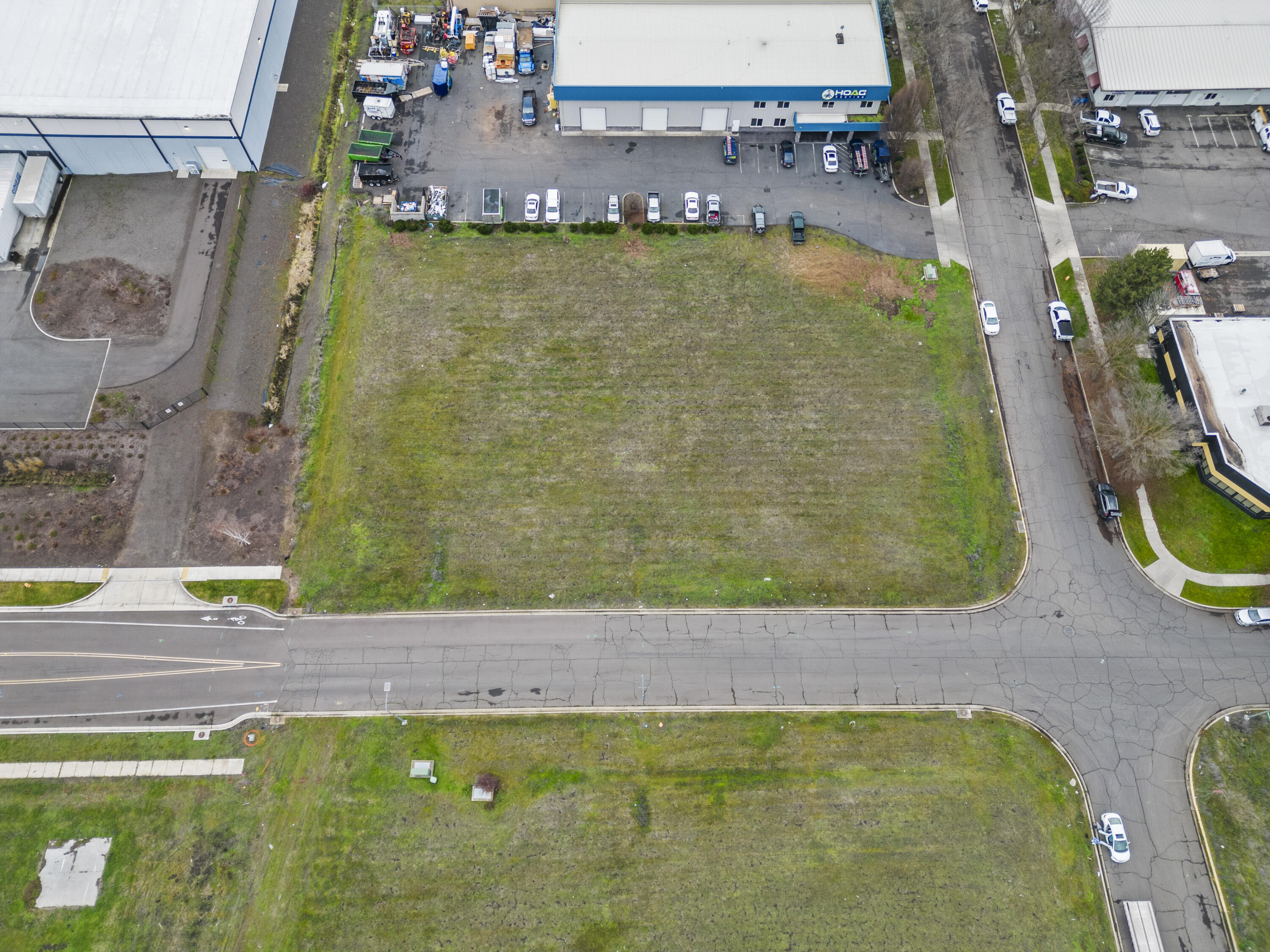 This Opportunity Zone Commercial property is close to the Medford Airport. It is zoned for many potential uses and is in the Vilas Industrial Park. The property is a 1-acre corner parcel with great access, close to the new expressway, airport and centrally located. The utilities are at the property. Opportunity Zones are a tool for economic development. They usually allow investors to defer, reduce, or eliminate taxes on their unrealized capital gains. Current information indicates that this parcel is in the opportunity zone. Close to the new Pepsi, Amazon and City of Medford Center.