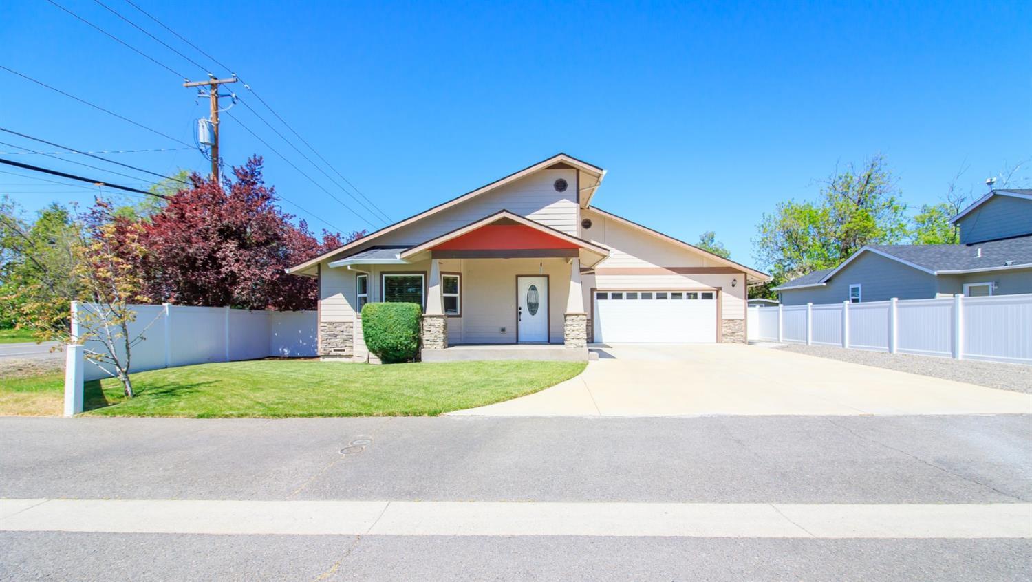 This well maintained all main floor living Craftsman will be sure to delight! Come see this 1708 sq ft. home, built in 2014, with 3 bedrooms and 2 full baths, 2 car over sized attached garage & plenty of space for all your needs. The entry way, living room & kitchen feel open & light with 12 feet vaulted ceilings & wrap around built-in shelving for plants and art work. The kitchen has granite countertops, tile backsplash, walk-in pantry and custom kitchen wood cabinets. There is access to the outside patio via the kitchen for patio dining with family and friends. Both bathrooms come with granite countertops and tile floors. The entry way, living and hallway spaces are hardwood. Outside, the side and back yard are fully fenced with a 50x13 RV space adjacent to garage. Landscaped front yard w/sprinkler system & covered front porch. A cement walkway wraps around the entire house. You'll find a professional 10x15 shed in back for all your storage or hobby needs. Don't miss out on this one!