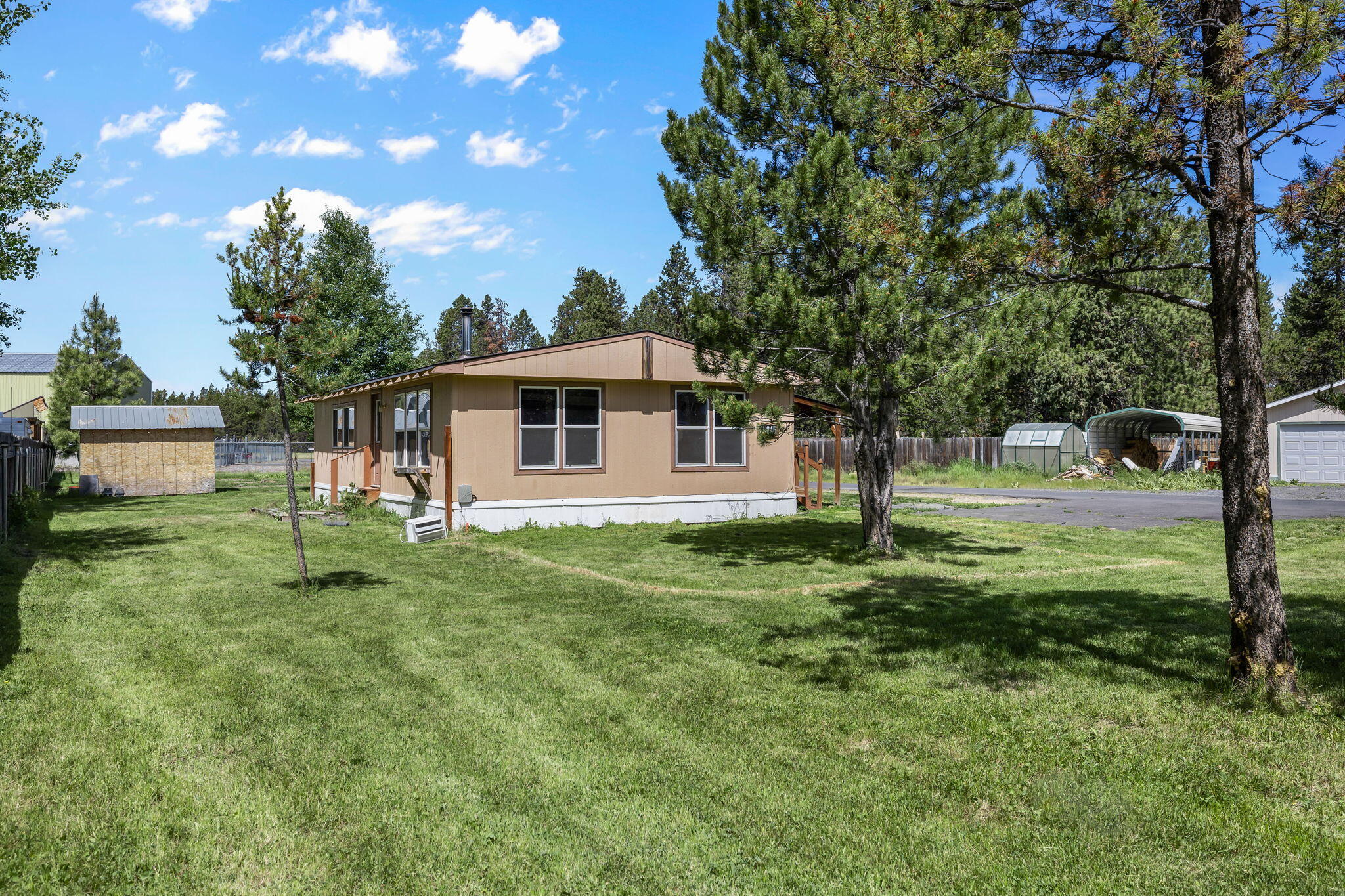 Great investment opportunity in Bend! Located on just over a half acre,
this 2 bed, 2 bath, 960 SF home has been nicely updated inside and has
new carpet, new SS dishwasher, cherrywood cabinetry, tons of storage
space and lots of natural light! Plenty of room to build a shop or
detached garage. Home needs a plumbing repair (Contact agent for
details) and will be sold as-is. Great opportunity to buy a very livable,
cute home in Bend at an unbeatable price! Great location with private
community river access, close to hiking and biking trails, Sunriver, the
Deschutes river and Mt Bachelor!