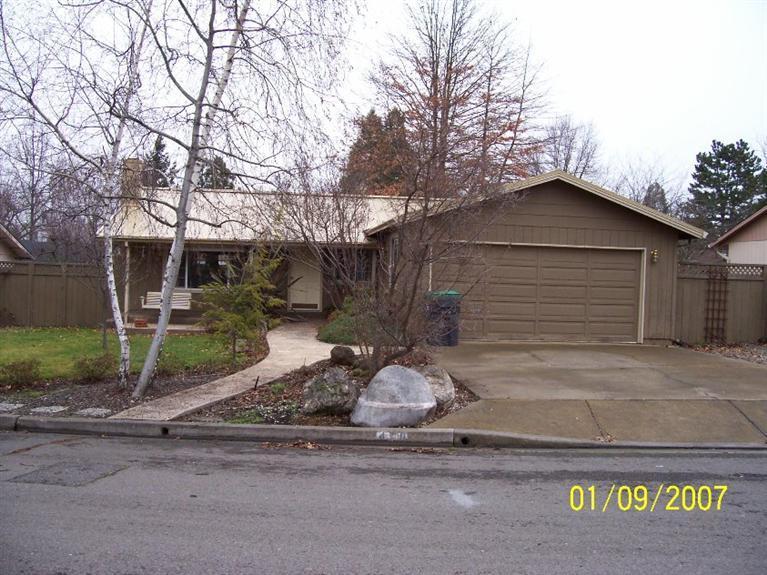 Wonderful single level home a short distance to the center of town. 3 bedrooms, 2 bathrooms, living room with wood burning fireplace, kitchen faces the backyard which has a large deck and seating area. Central heat and air conditioning, metal roof and 2 car attached garage. This is truly a feel good home.