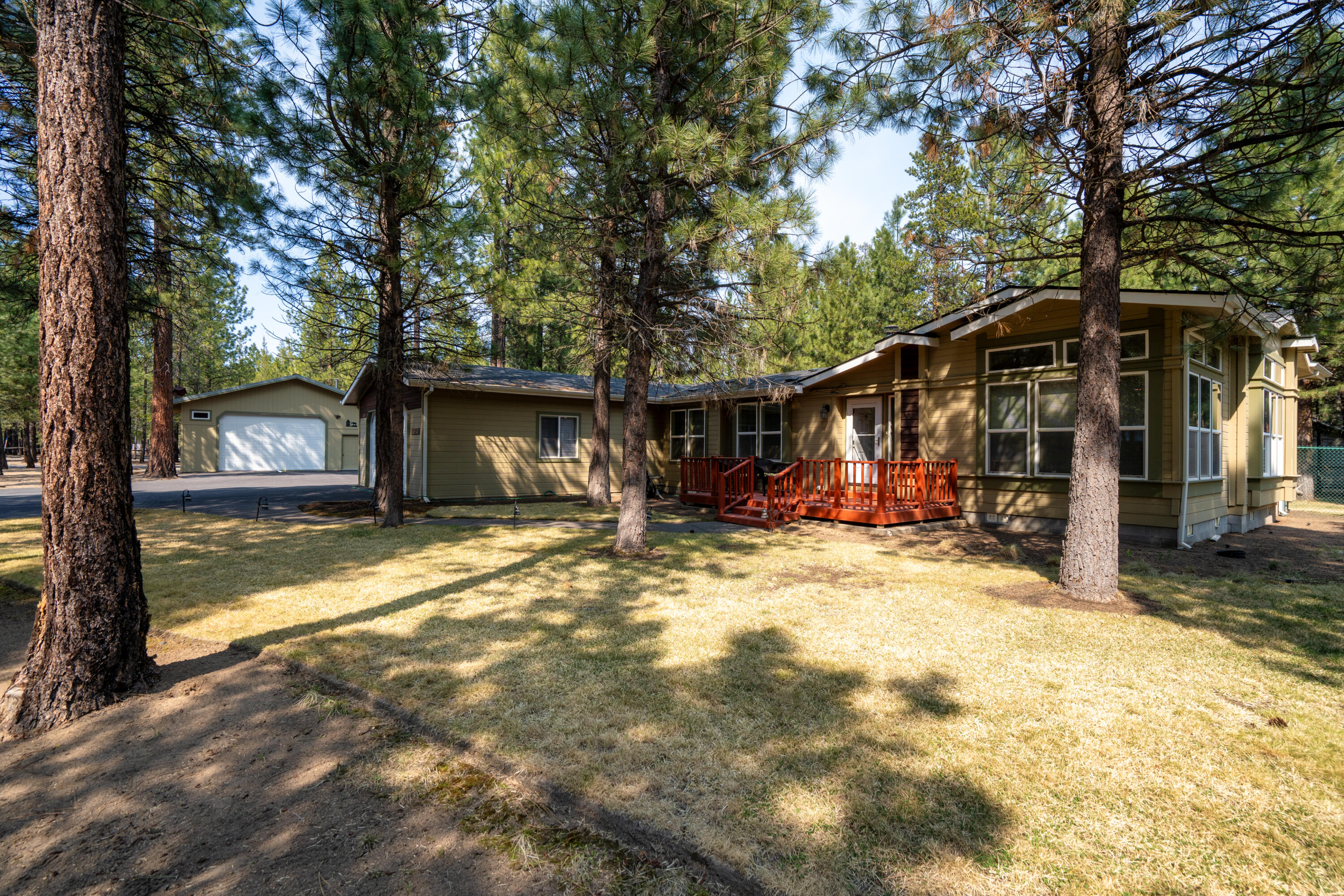Set on over an acre, this property offers space, privacy, and versatility in a beautifully light-filled setting. The home is designed to maximize natural light, with spacious living areas including a formal dining room, family room, and a kitchen with a convenient breakfast bar, perfect for casual meals and gatherings.
The expansive primary suite is a true retreat, featuring a private sitting room or office, ideal for work or relaxation. The 32 x 32 workshop provides incredible flexibility for hobbies, projects, or storage.
Additional features include a storage shed and a wood shed, offering ample room for tools, equipment, or seasonal supplies. Enjoy a pleasant view on either the back deck or front deck. Whether you're seeking a peaceful escape or a functional space to live and create, this property delivers room to grow in every sense.