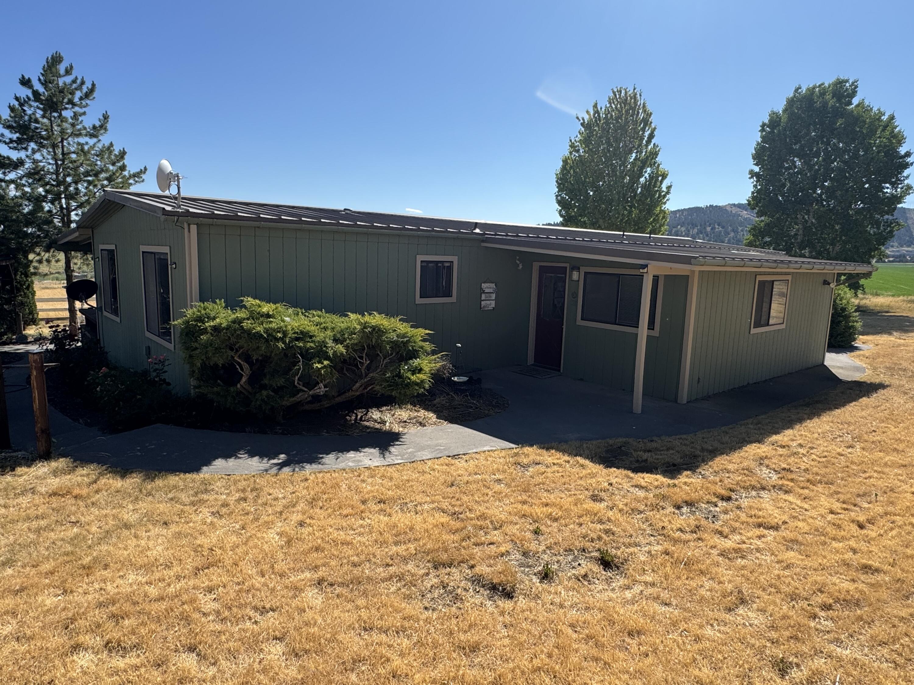 Nestled between the two towns of Merrill and Malin, this recently divided 2.84-acre Home has everything you need, a wonderful updated manufactured home, some beautiful landscaping that just needs some water, and a nice little fence pasture for some animals. This property also has a huge 30 x 70 Shop with a pit and a hoist as well as a loft and an RV garage that is 20 x 40. Come, take a look at this wonderful mini farm! Owner may carry with acceptable terms. We have a Lender that will loan on this property with 0% down 30 fixed rate loan and no prepayment penalties. Contact us now for more information.