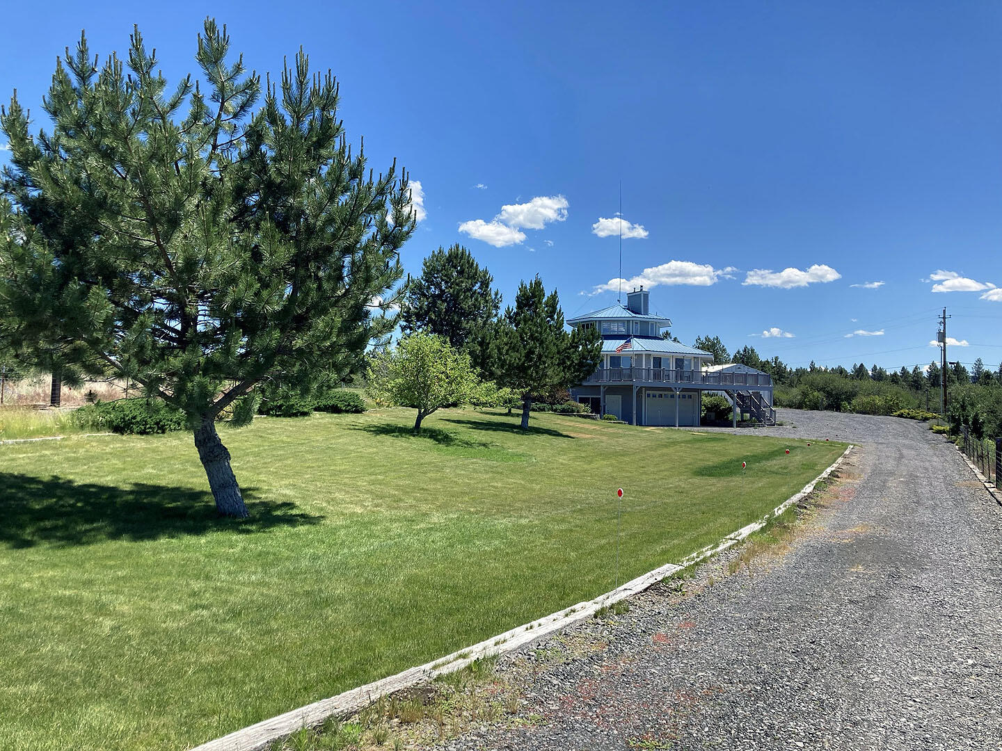Seller will look at any/all back up offers. This custom home has gorgeous view of the cascades, this 1.57 acre of land sits on a well manicured yard with a huge workshop, bathroom w/shower, workbench with space for an RV. Entering this 2300+ft home you head upstairs to a 360 degree cupola/view. Below we pass a bathroom, bedroom, and office able to be turned into a 4th bedroom. The master bedroom has a custom bedroom set, walk in closet and large spa like bathroom. The open space living room is lined with 5 sliding doors leading into a large deck w/view great for BBQ's. The kitchen has custom cabinetry, a double sink and appliances, laundry room with washer/dryer and pantry. Downstairs there is a bathroom w/shower,bedroom,2 car garage and workspace. This amazing home sits on top of a hill with great views, split ac units, solar system, radiant heat 3 wood fire stoves, automatic propane generator all inside a safe and secure gated residence