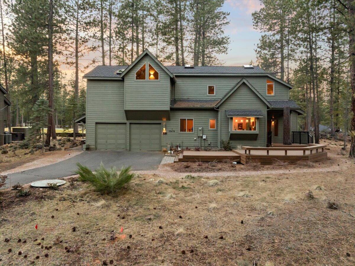 Experience resort-style living in this stunning Glaze Meadows Golf Course home, offering breathtaking fairway views and main-level living. Designed for entertaining, the entertainer's kitchen boasts quartzite counters, high-end finishes, and a seamless flow into the dining and living areas. A 14' accordian slider opens onto an expansive Trex deck overlooking the 7th fairway and green, creating an incredible indoor-outdoor living space. Relax by the woodburning fireplace with oversized windows framing the picturesque golf course. The luxurious primary suite features a spa-like ensuite with marble countertops, high-end finishes, and a private sauna for ultimate tranquility. Three additional bedrooms provide ample space, while refreshed flooring throughout enhances both style and comfort. Just minutes from Glaze Meadow Recreation Center.