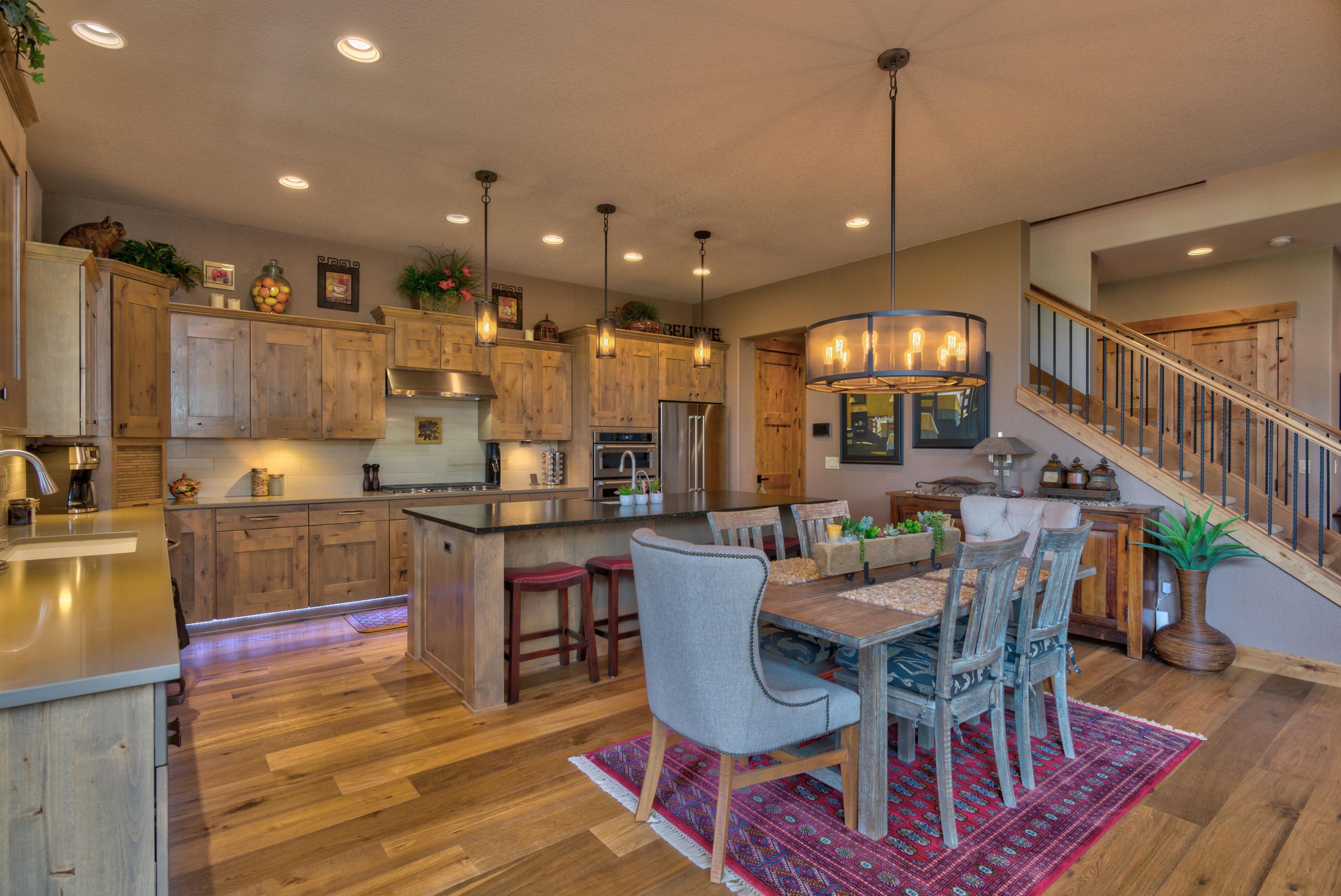 Newer townhome in Points West gated community just minutes from downtown Bend with quick access to Mt. Bachelor, the Cascade Lakes, and endless trails for biking/hiking. Serene view from built in firepit on paver patio overlooking lava canyon and the Deschutes River. Chef's kitchen with s.s. appliances, including island with sink. Master on main with two en suites upstairs provide excellent accommodations for gatherings and overnight guests. Expansive bonus room upstairs with direct access to spacious deck. One of the larger lots in development and among only a handful situated next to a beautiful canyon. Spare downstairs bedroom with French doors could be used for den/office. HOA provides all landscaping. Listing Agent is related to Seller's.