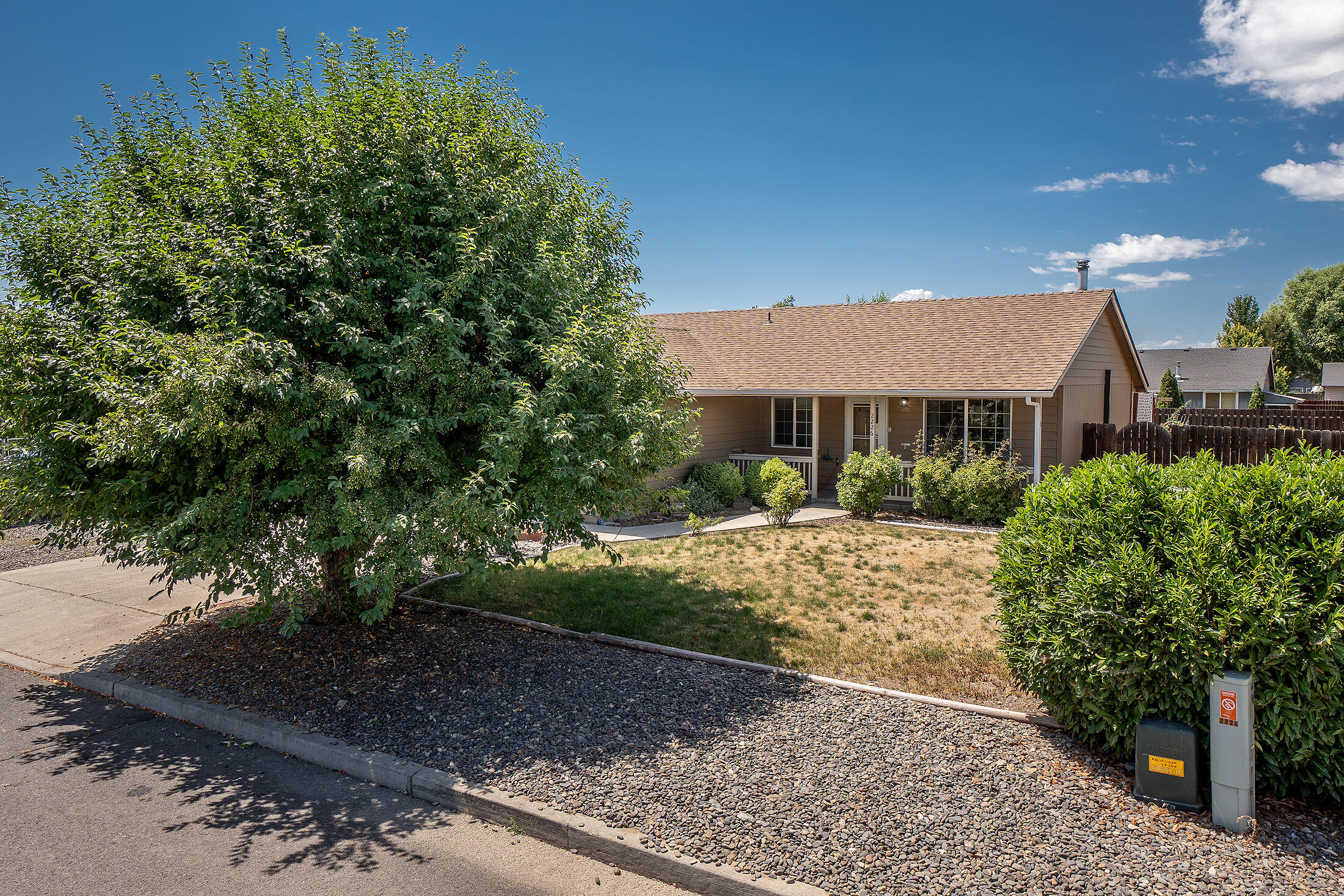 This nice 1,008 sqft, 3 bd/2ba home had a new roof installed in 2023, so buyers can check that expense off their list! The eat-in kitchen offers oak cabinets, a pantry, white appliances, & a new range. The living room boasts laminate floors, a wood stove, a mini-split, & ceiling fan for your comfort. The Primary suite includes a ceiling fan & an ensuite with grab bars & a hand-held shower head. The hall bath has a tub/shower combo & grab bars. The laundry room comes with storage, a linen closet & full-sized W/D. The finished garage has an insulated door, a man-door, an opener & grab bar. Out front, there's a nice covered porch for relaxing & enjoying your favorite beverage. The large backyard features a deck, covered patio, automatic sprinklers, over 11 garden beds, RV parking & shed.  At closing & with a full-price offer, the Seller will credit the Buyer $1,174 toward replacing the kitchen/dining area floor.