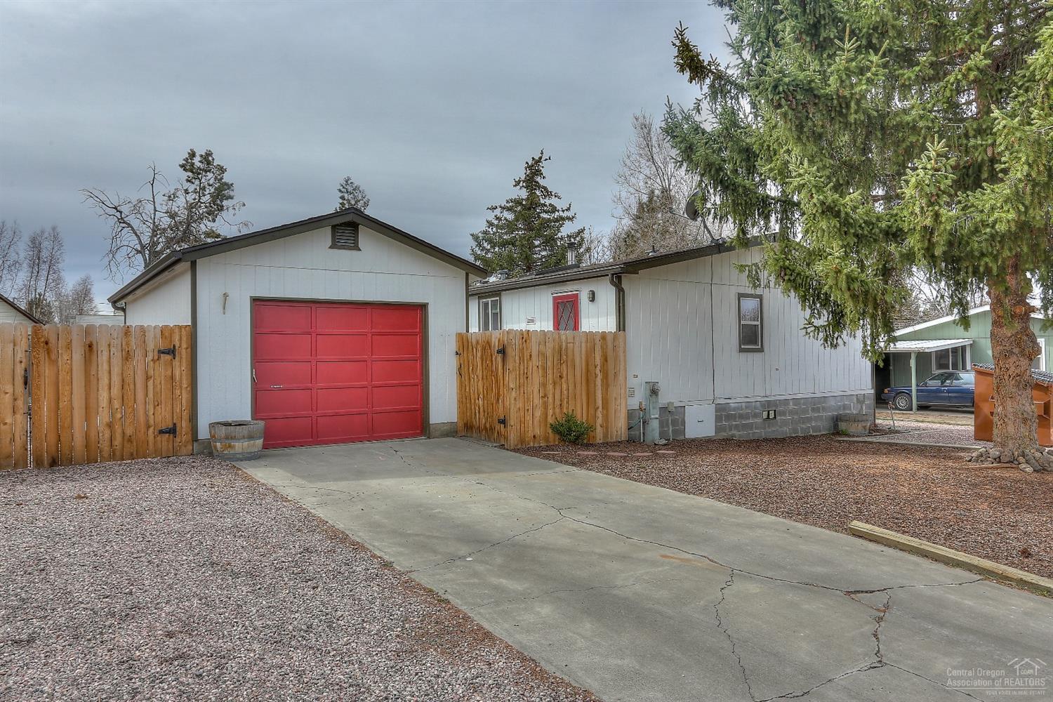 Well cared for home, close to schools and shopping. Utility room, pantry, fenced and landscaped yard, wood stove is certified and single car garage. Room for your RV!