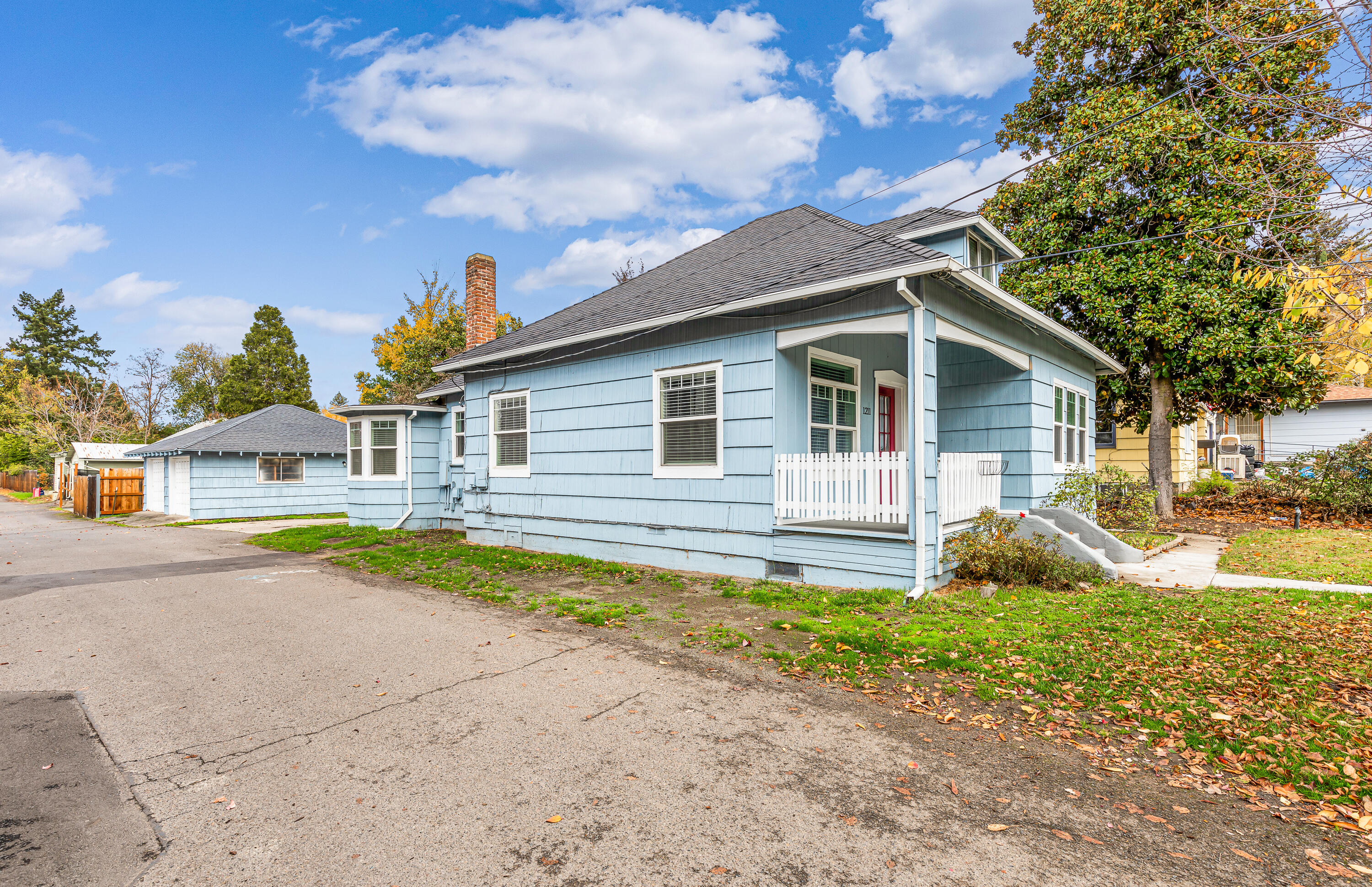 Super cute East Medford cottage & very close to downtown shopping, restaurants & medical. 1910 built home that has been remodeled w/newer kitchen & stainless steel appliances, convection oven w/glass cook top, cabinets & flooring.  Lg breakfast room w/bay window, separate office + 3 bedrooms & 2 updated baths.  Dbl pane windows throughout. Nice baseboards & 6 panel doors, lots of hardwood floors, high ceilings.  Lg cement patio w/ lg backyard, oversized 2 car garage, central gas heat & central air.  Zoning will allow for an additional dwelling unit (Buyer to do due diligence with the City of Medford) Newer roof.