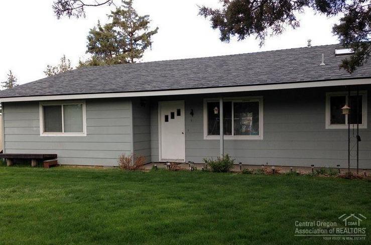 Home sits back from Brosterhous on .3 acre surrounded by landscaped views. Lot has privacy while close to all conveniences of Bend. Home has attached 1-car heated garage, perfect for shop or hobby area and an addition detached 2-car garage. Plenty of room for toys. Great home for someone looking for elbow room in town or a great investment property.
