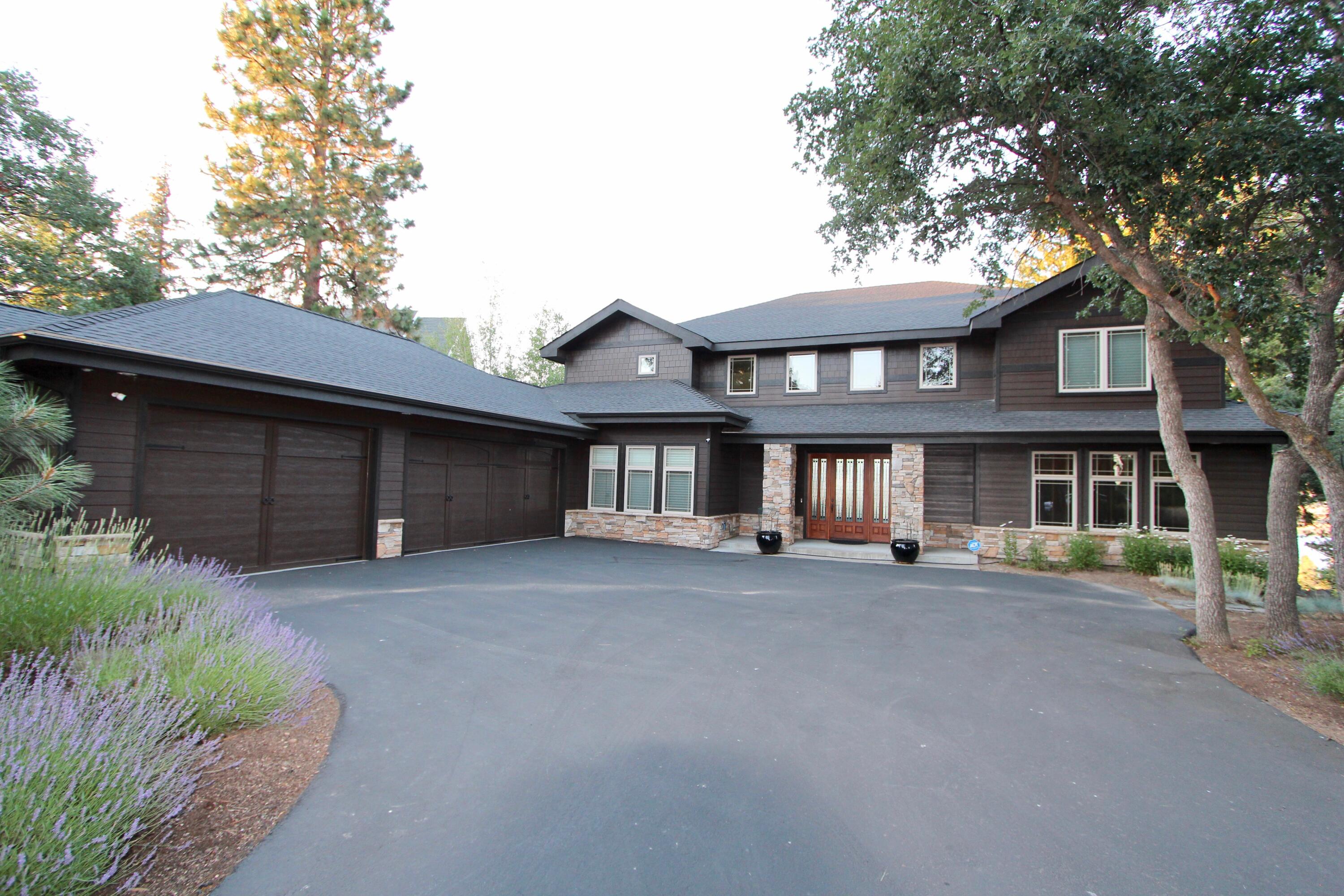 Running Y ridge home with spectacular lake and mountain views.  Custom 4 bedroom plus workout/media room, 4.5 baths - office with built-in Cherry wood book shelving - Beautiful specialty Oregon Oak wood flooring in the  living and kitchen areas -  kitchen with granite counters, double ovens, gas range top, center island. The large trek deck has a built in natural gas fire pit.  Running Y Resort is sought after for its many home owner and resort amenities that include fitness center, indoor pool and sauna, tennis, pickleball, basketball, and volley ball courts, playground, 6 miles of paved walking trails, wild land walking trails, restaurants and more.