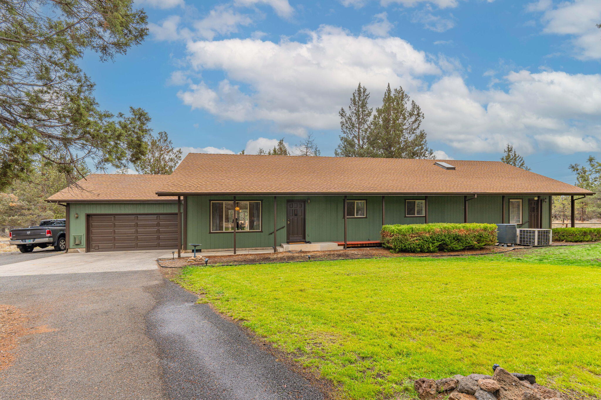 Imagine coming home to this tranquil 2.26 acre setting in the trees just east of Sisters.  The remodeled 2,304 sf single level rancher boasts 3 bedroom, 3 baths, in addition to a large office; including a separate living area with separate entrance:  Ideal for multi-generational living needs.  In addition to the attached double garage, the property includes a shop with new garage door and opener, as well as a 2nd story room with lots of options.  The home has dual AC units, a private well, sprinkler systems, storage buildings, and frontage on a paved road.