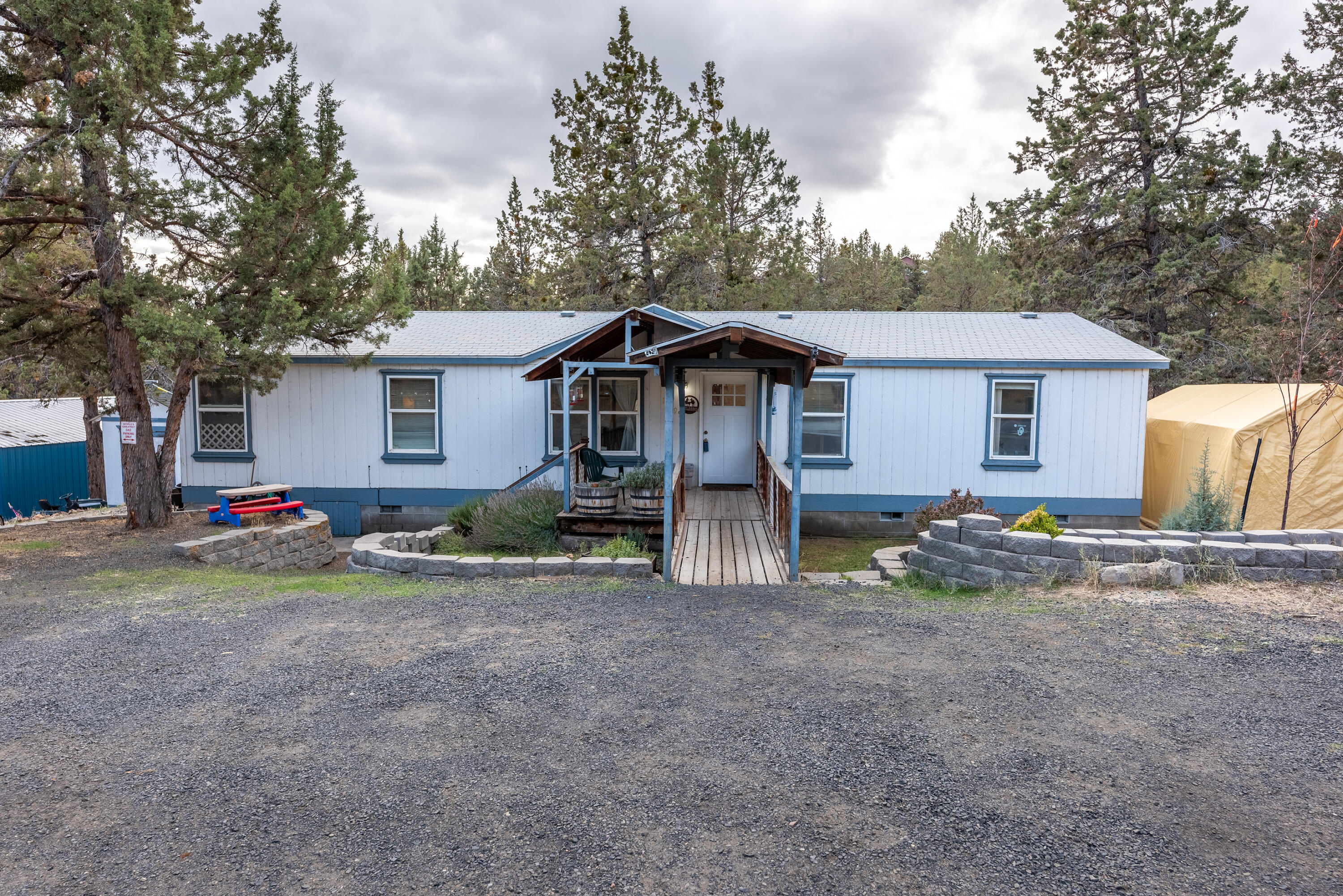 Motivated Sellers!! Home on .63 acres in the lovely Ochoco West Community. Home features extra large rooms and has new cabinets in kitchen and laundry room. There is a storage shed for your gardening supplies and a 1,000+ sqft shop with electricity and a woodstove. The triple lot next door is also available for $99,000 for those who may want an extra large parcel, or to build next to family. Nicely treed lot w/ room to roam & parking for all of your toys. Come enjoy all the amenities Ochoco West has to offer! Swimming pool, club house, shooting range, miles of trails for your horses or ATVs, horse boarding, private fishing lake, etc. This home is on community water.
