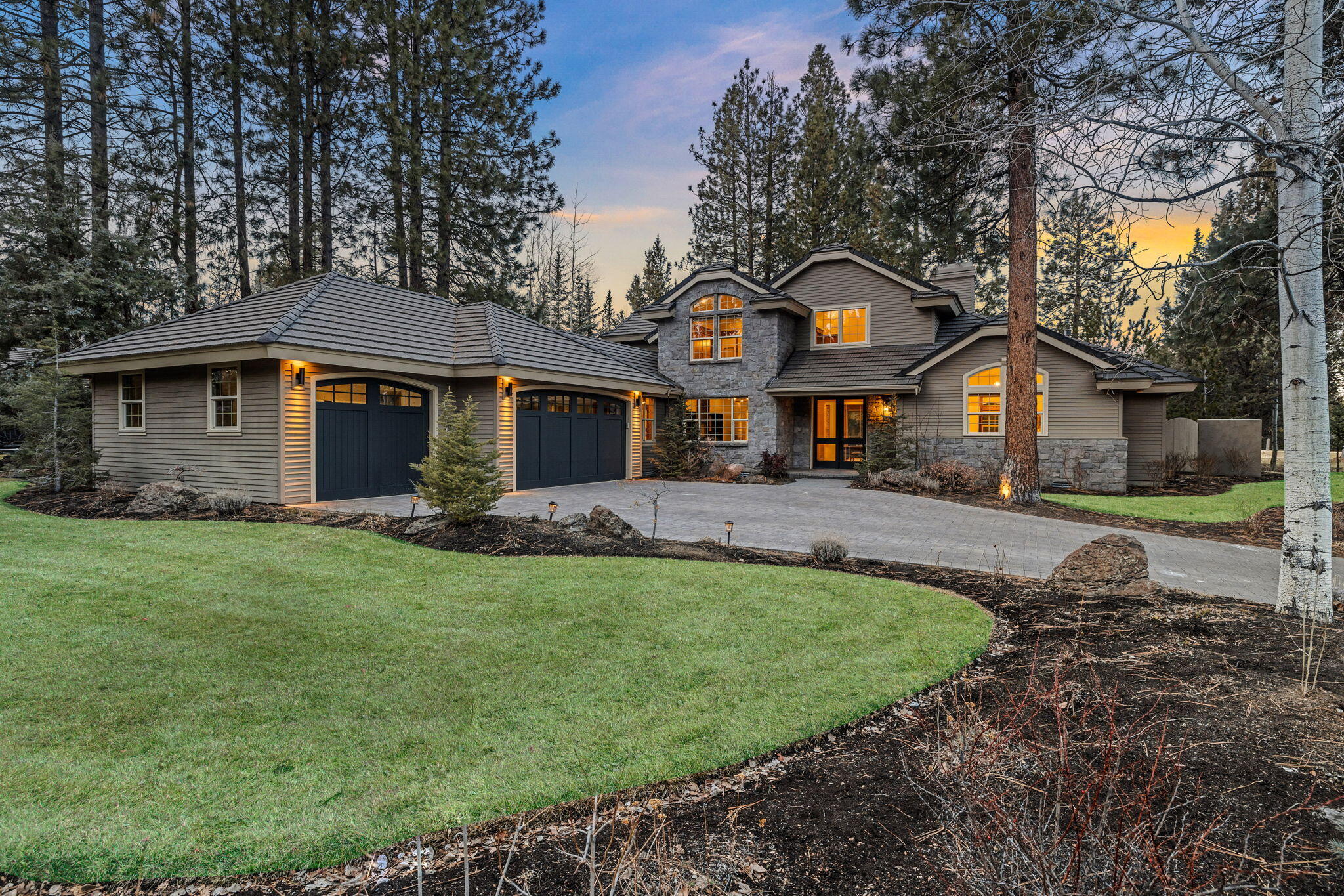 Fall in love with this completely renovated home snuggled into an inviting cul-de-sac in Bend's highly desirable Broken Top Community. Located in a park-like setting at the end, beautifully landscaped with plenty of play space for children young and old. A generous water feature in front greets you with a calming flow. Another, multi-tiered water feature in back enhances your outdoor experience, providing tranquility for moments spent savoring the verdant backyard. This airy, south facing home gets flooded with natural light throughout the day. Once inside, the floor plan is ideal for the modern family. Primary suite boasts vaulted ceilings, private patio, beautiful bathroom, and walk in closet. The chef's kitchen is a show stopper: oversized quartz island, newer top of line appliances, and custom cabinets. A second BD and BA, sitting room, plus laundry round out the main floor. Upstairs has two additional en suite BD's and media room that could be a 5th BD. A rare offering, indeed.