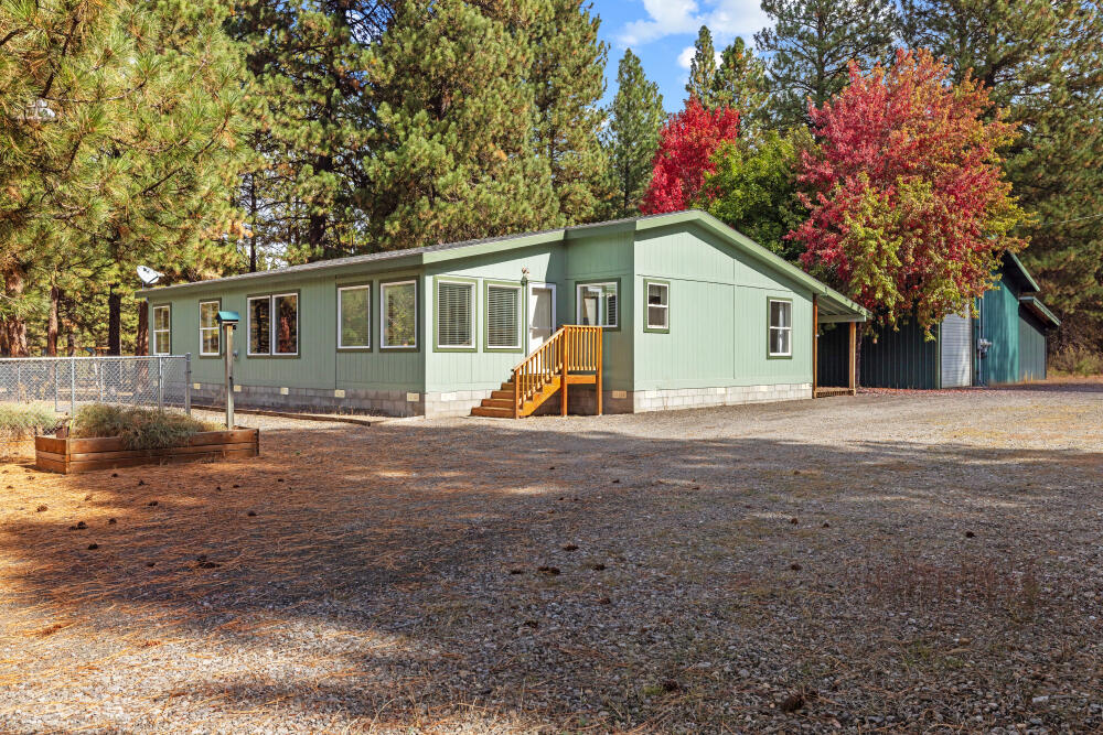 Beautifully maintained and move-in ready, this open concept home features a bright sunroom, covered back deck, pellet stove, and a spacious kitchen with island, pantry, and ample counter space—perfect for cooking or entertaining. The large primary bedroom includes a walk-in closet
and generous bathroom. Two additional bedrooms, plus a laundry room with sink and plenty of storage. Outside, enjoy a 48x32 shop with 220 power, bathroom, oil monitor heater, and upstairs space ideal for storage or crafting. Additional covered parking fits a car, truck, or tractor Property also includes a fenced garden area ready for your green thumb. Just 15 minutes to Lake of the Woods and 10 minutes to Rocky Point—peaceful living on an acre lot.