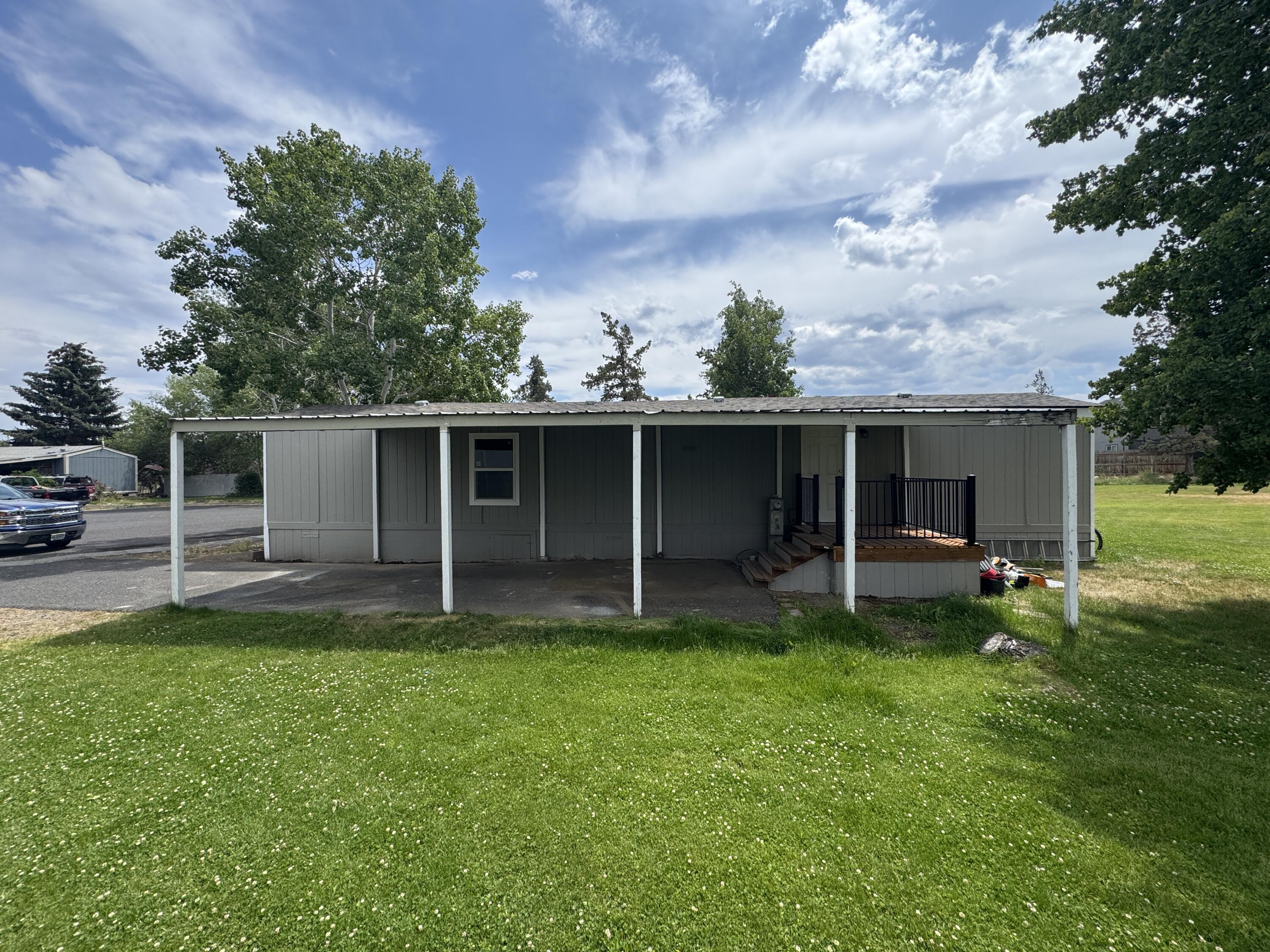 Price reduced! This beautifully remodeled home or investment property offers great ROI potential in a centrally located Redmond park with one of the area's lowest space rents at just $440/month. Close to schools and the Dry Canyon trail system, this like-new home features all-new white cabinets, tile countertops, custom tile backsplash, stainless steel appliances, vinyl windows, LVP flooring, carpeted bedrooms, tiled shower with tub, updated sinks, faucets, fixtures, lighting, toilet, fresh paint inside and out, a spacious covered deck, rear entry, and large carport. Washer and dryer included. Renters and dogs allowed with park approval. Financing options available—contact Renee Dornhecker at Landmark Professional Mortgage: renee@landmarkprofessional.net