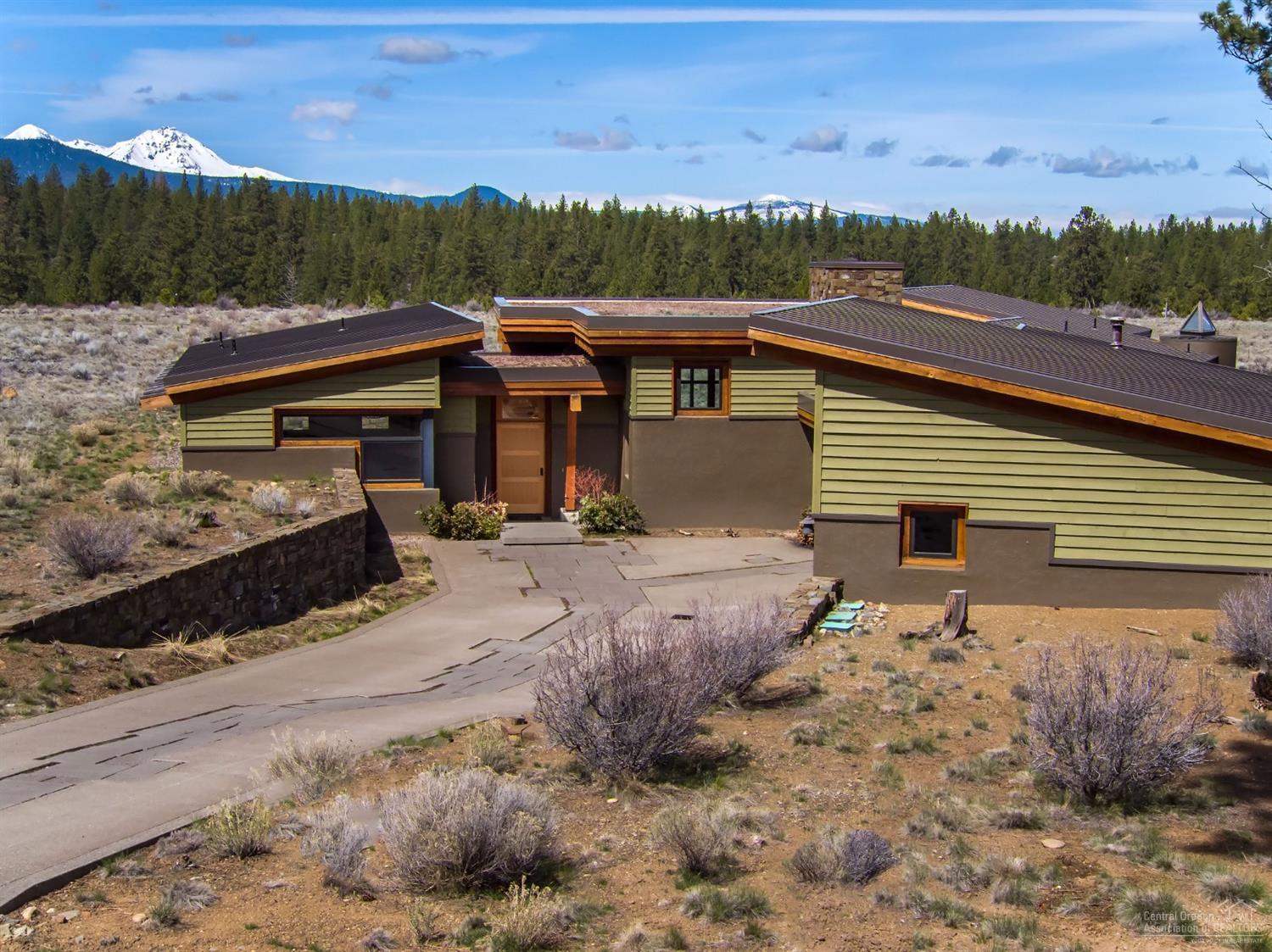 This Shevlin Commons home blends modern architecture with a sense of nature. As you step through the front door the house opens up to show off the magnificent Three Sisters and adjoining Cascade Mountains!