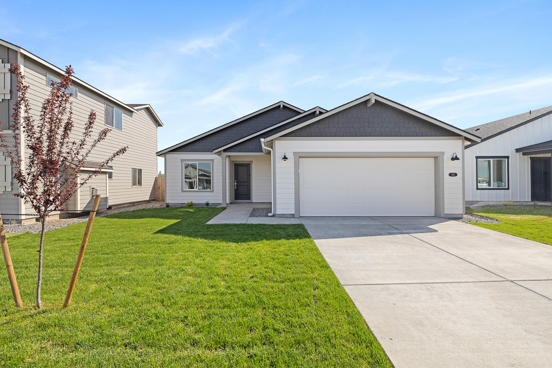 New 1488 SQFT, single level home. This 3 bed 2 bath new construction includes a deluxe chef's kitchen with quartz counters, pantry, island, dishwasher and 5 burner stainless air-fry convection range. Master bath with double sinks, shower and large walk-in closet. 95% high efficiency gas forced air heating, gas fireplace, laundry room and covered patio. Ask listing agent for builder incentives.