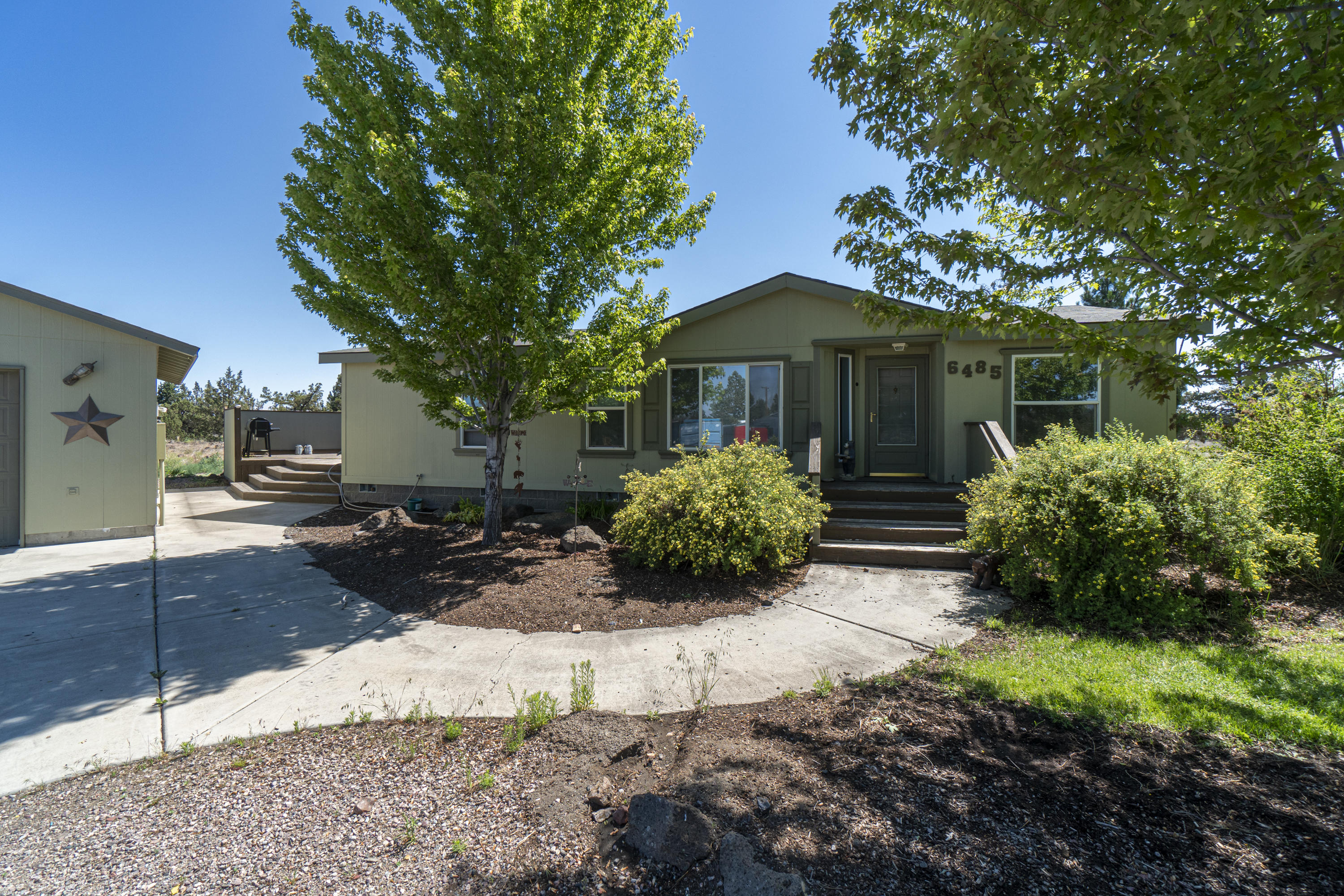 Great opportunity to own 2 homes on 5.21 Acre property in SW Redmond. 2 homes include a 1296 SF, 3 bedroom, 2 bath manufactured home built in 2001 with large deck and detached 2-car garage. Plus, an 880 SF., 2 bedroom, 1 bath home built in 1939 that was used in the past as a rock shop and has its own storage building/workshop. Easy access to Deschutes County Fair & Expo Center, Redmond Municipal Airport and a short drive to Bend.