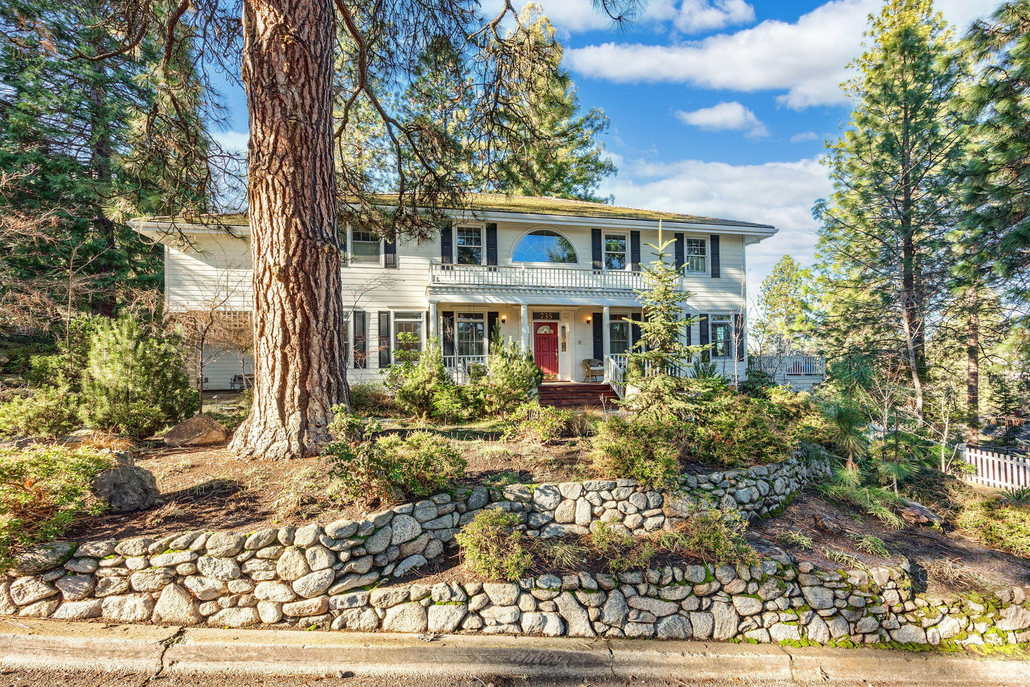 This is truly a one-of-a-kind property on.94 acre above SOU in Ashland. There are five bedrooms, six bathrooms, beautiful hardwood floors, a gourmet kitchen with Aga range, an expansive deck and a fabulous pool. The main floor has a great room, dining room, music room, and a grand staircase going up to the second floor. The architectural details in this unique home are elegant with arched doorways, large windows, and lovely natural light on each floor. It is a wonderful home for entertaining, with an upper deck and a lower deck. The guest house is beautifully designed with skylights, kitchenette and full bathroom. There is also a convenient glass elevator to access the second floor that flows with the floorplan. There is a 500 sq.ft. bonus room (daylight basement), above the garage office and a workshop off the garage. There are three separate tax lots for this property, fully fenced, with beautiful views, and mature trees. It is your own private sanctuary in town. A must tour home!