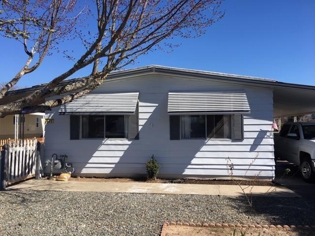 Lovely home in friendly 55+ community. Take a stroll to the large lake near the clubhouse or to the very popular Reinhart Park! And it's close distance to the beautiful Rogue River! This home has had many updates and some are still in progress (but will be finished before close of escrow). There are new appliances- dishwasher, garbage disposal and gas stove, as well as new interior and exterior paint, new carpet and wood laminate, new ceiling lights, subway tiles in second bathroom and back splash. The master bedroom is large with his and hers closets. Outside the home is a peaceful oasis to enjoy the mountain views. Sale to include one year home warranty. Call to make an appointment to take a tour!