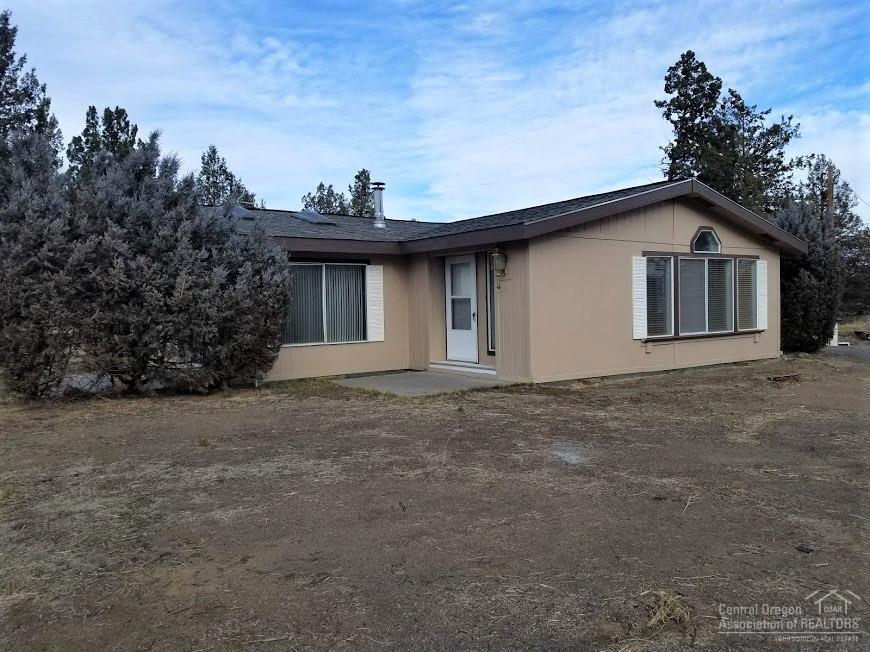 What a buy!! Where else can you find acreage with wonderful mt. views, 5.6 acreages, 1800 sq ft heated & insulated shop plus office area, convenient Tumalo location. 2.5 acres Tumalo irrigation, shared well, plus 3 bed/2 bath In addition there are 2 pasture areas plus pond. Shop/home have certified wood stoves. Home has a brand new roof and fresh exterior paint. Tumalo/Redmond schools. Great area for hobby farm. Build your dream home while living in the current home.