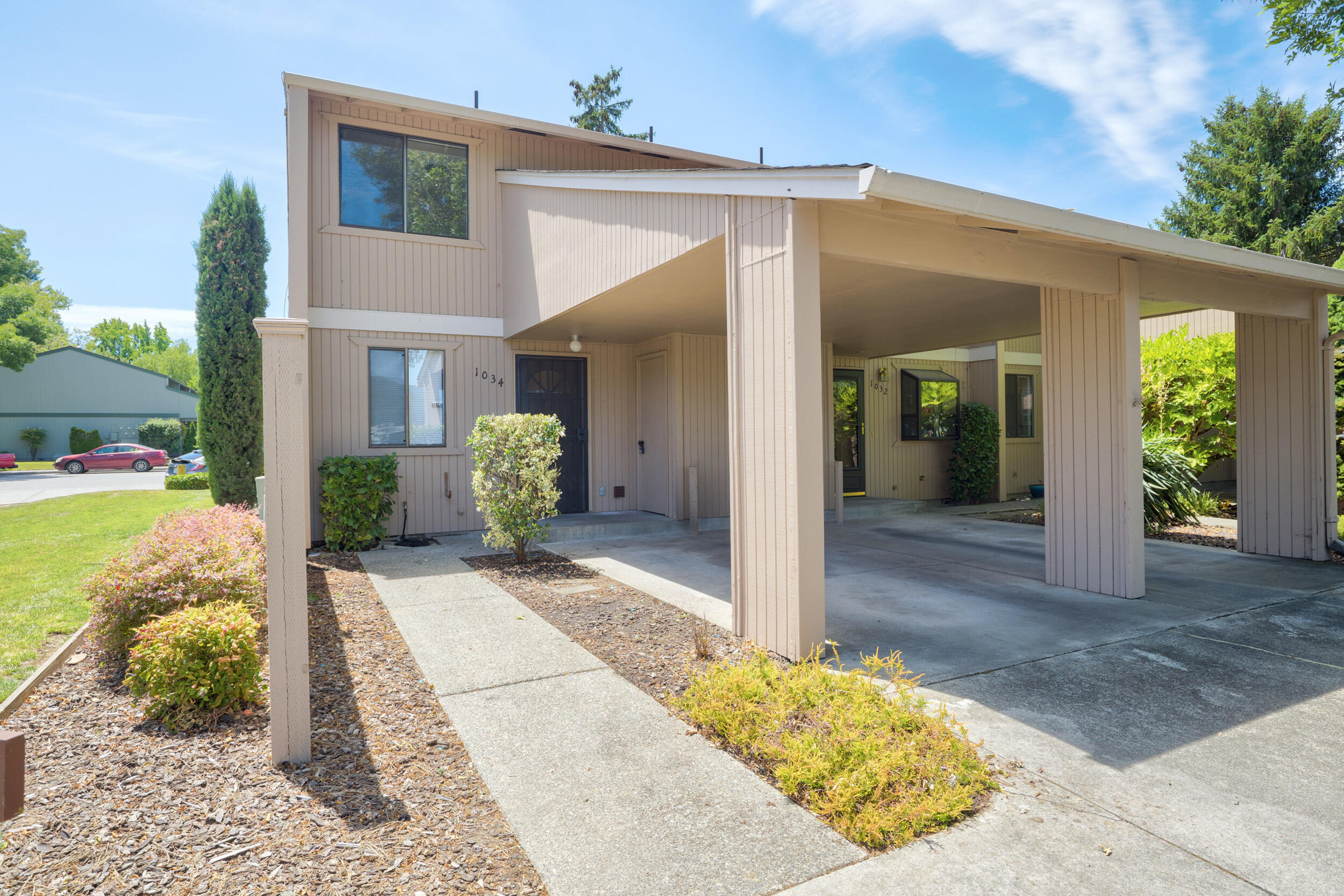 Great New Price! Welcome to your new home! This condominium has two spacious bedrooms with new carpeting  and beautiful laminate flooring throughout the remainder of the condominium.  The front bedroom has a large walk-in closet.   There is one full bath upstairs and an additional ½ bath, conveniently located in the laundry area on the main level. Enjoy a private, fenced backyard patio, perfect for relaxing or entertaining. Plenty of closet space and two storage sheds make settling in a breeze.  Located close to City Center and essential services, this condo is ideal for anyone looking to live in a vibrant and accessible area.  Monthly HOA fee is $235.