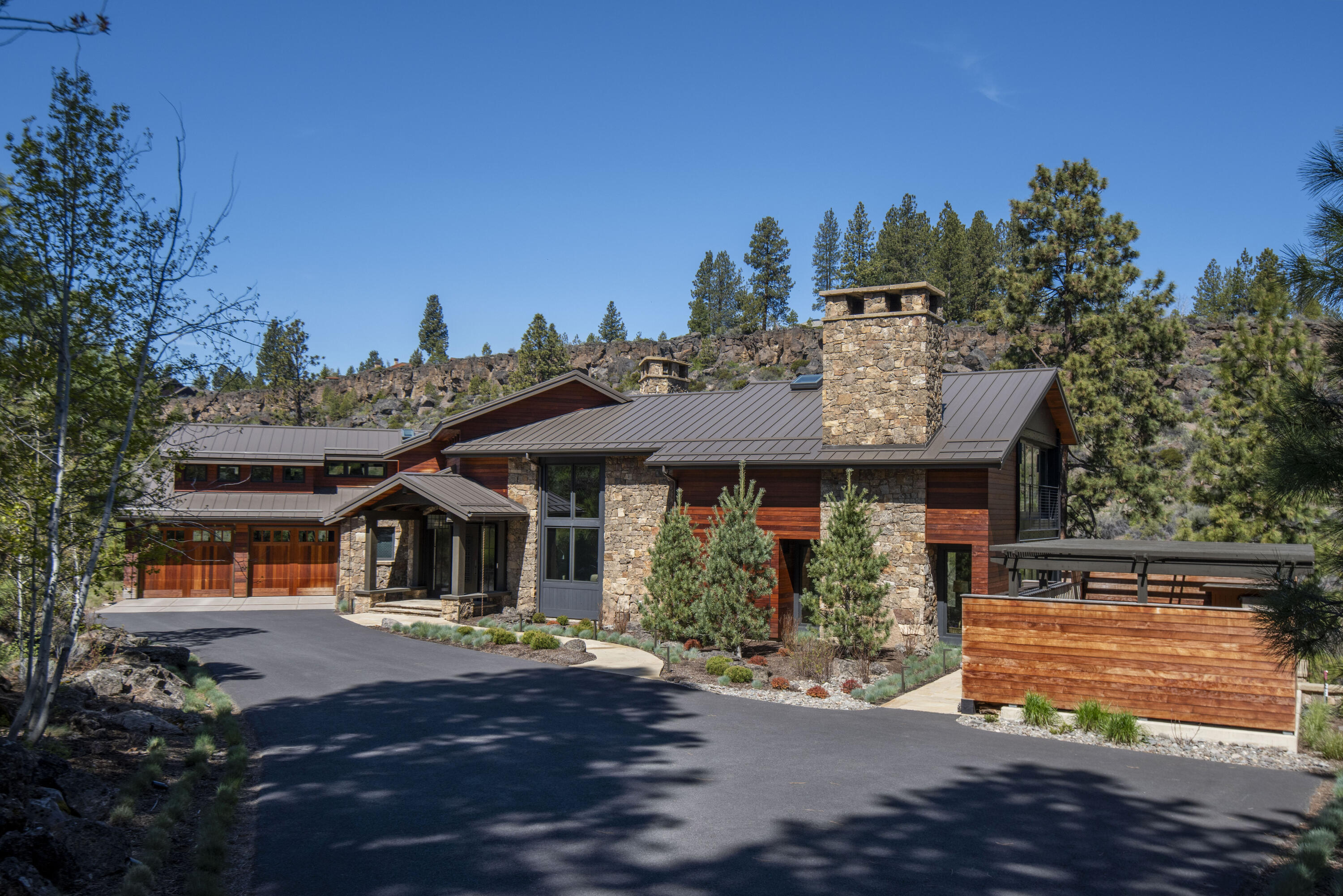 One-of-a-kind Deschutes riverfront setting in Bend. 2.73 acres w/over 510 ft of upriver & downriver frontage, this spectacular home sits approximately 25 ft from river's edge, making this an irreplaceable build. This private estate is nestled in nature w/ privacy & space, yet minutes from Old Mill. Everything is customized in this Northwest modern, 2 story design w/extensive use of Artisan metal, IPE wood, Montana Moss harvested stone & hand carved German Shrunken Oak flooring and ceiling. Thermador Appliances: Oven/Range, Range hood w/ Artisan Metal, Refrigerator, Microwave, Warming Drawer, and 2 Dishwashers. 3 Sub Zero Beverage Refrigerators, U-Line Ice Maker, 2 Maytag Washers/Dryers, Jen-Air trash compactor, LG Steam Closet, and on demand hot water. Enjoy ultimate relaxation in your custom built spa, viewing kayakers shooting the rapids! Land Lease of adjacent .55 acre parcel is included which has a 2,781 sqft riverfront second home optionally available.