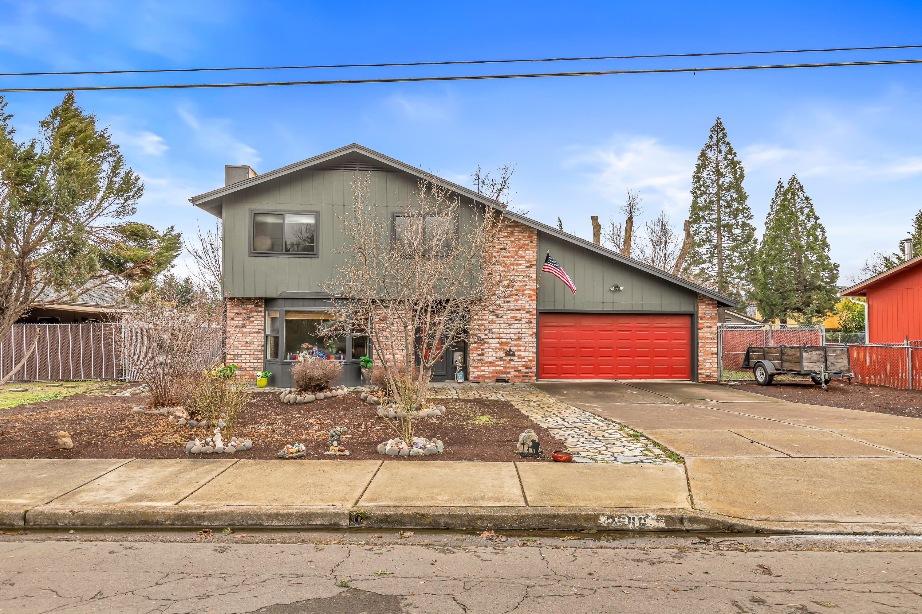 Amazing opportunity to buy a large home in East Medford at an affordable price with recent updates. Main floor has great living space with an open island kitchen and family room. There is a spacious living room viewing towards the front of the home. Upstairs are the 3 bedrooms and two full baths. New carpet was installed upstairs April 2025 along with new paint. Off the backside is an enclosed room with a spa. Out back is a sizable backyard and to the side is a large RV parking area. New solar was installed a year ago along with a new roof and a solar hot water heater.