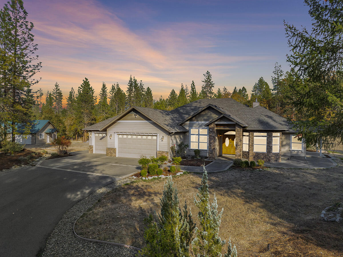 Welcome to Your Dream Retreat!  Nestled in an Upscale & Quiet neighborhood, this Custom Built 2459 sq ft home & 1200 sq ft Shop are situated on 5.82 Level Acres, offering Tranquility & Privacy! With 3 Bedrooms & 2.5 Baths, one guest room can easily serve as a Second Master Suite with its own patio.  Enjoy the large open living area with 13' ceilings, beautiful tile entryway, separate dining room, & fabulous kitchen with ample cabinetry!  The Spacious Primary Bedroom with Coffered Ceilings boasts Gorgeous Tile throughout the En Suite with Dual Vanities, Walk-In Shower, & Jetted Tub!  Outside, enjoy the covered patio and stamped concrete walkways!   The 30' x 40' Shop/RV Barn with 30amp hookups has 12' ceilings on one bay and is insulated, with heating & air. A Whole House Propane Generator is included and powers both the shop & home! Well Log shows 25 gpm! With so many upgrades, this home combines Elegance & Practicality. Live the life you've always dreamed of!  Home Warranty Included!