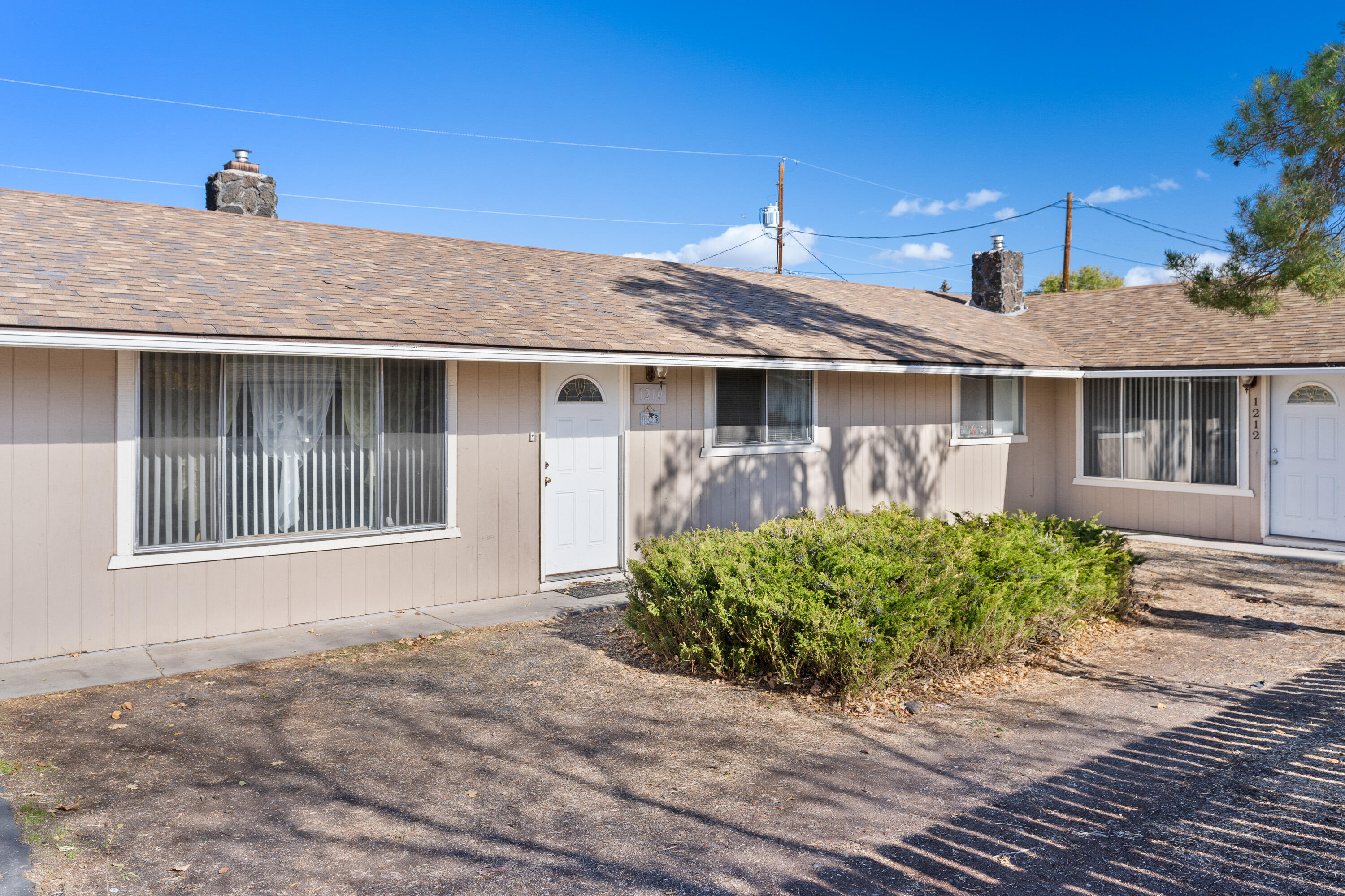 Prime Investment Opportunity! Two single-level duplexes with nearly 20 years of solid rental history, situated on a generous half-acre across two tax lots. Each duplex boasts a spacious 1,899 sq. ft. layout, featuring one 3-bedroom, 2-bath unit and one 2-bedroom, 1-bath unit, offering flexibility and appeal for a variety of tenants. Enjoy cozy fireplaces, open dining areas, functional kitchens, and convenient laundry/utility rooms in all units. Each unit also includes a fully fenced, sizable yard for outdoor enjoyment and a single-car garage. This is a rare chance to secure a stable income property in a great location. Don't miss out on this excellent investment
