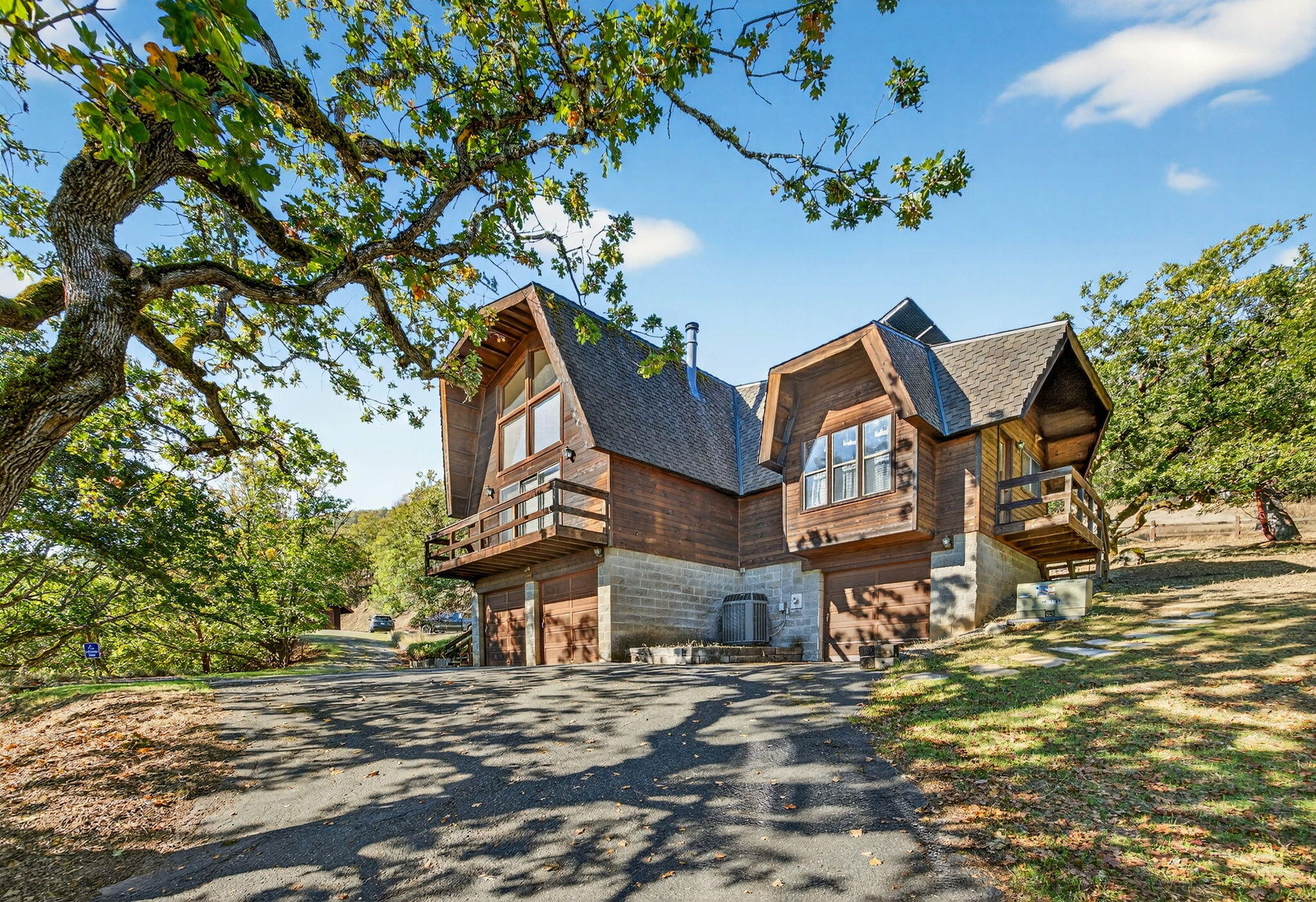 Charming Home on 12.67 Acres, 4 tax lots, Bordering BLM Land
This 1977-built two-story home offers approximately 1,815 sq. ft. of living space on 12.67 acres of serene countryside. The property features beautiful views and direct access to BLM land, just steps from the Rogue River. The home includes three bedrooms with a loft area, and two bathrooms, with one bathroom recently updated. The spacious primary suite is conveniently located on the top level, while two additional bedrooms are on the main level. Enjoy the natural light from large windows that capture the surrounding landscape. A good-sized barn provides plenty of space for storage, hobbies, or animals—making this property perfect for those seeking privacy, outdoor recreation, and rural charm.
