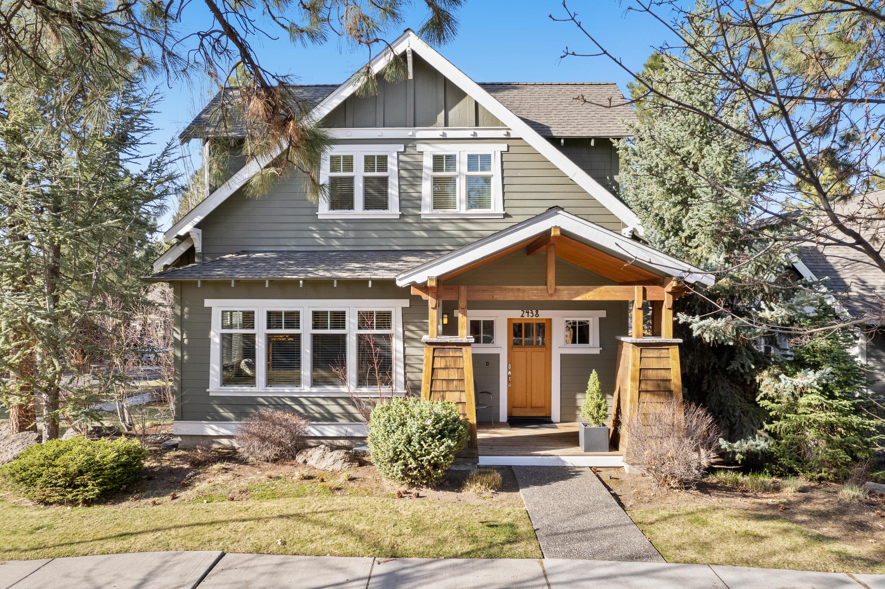 Welcome to this corner lot Bungalow in Bend's Northwest Crossing. The main home has an open floor plan with smartly placed windows that let the light in throughout the day. The kitchen features beautiful cabinetry, Jennair appliances, a generous island, concrete counter tops and a designated dining room. The mudroom has a built in desk that could easily be used as a small office. Upstairs you will find 3 bedrooms and 2 full baths. The ADU, completed in 2019, over the garage is 495 SF of living space. Beautifully finished unit with Bosch refrigerator, washer/dryer and dishwasher and a full bath. This neighborhood provides residents with conveniences like restaurants, shops, parks, schools and trails.