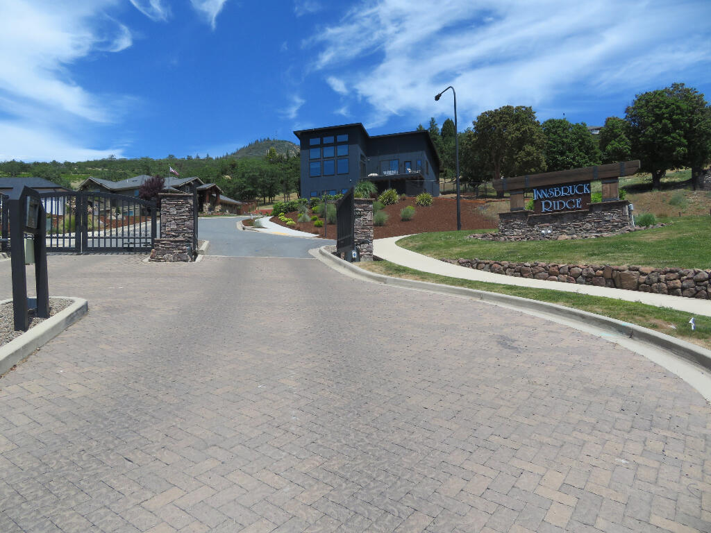 Plan and Build your dream home on an exclusive lot in an east-side gated community. This is arguably one of the best view lots in east Medford with stunning panoramic views including city lights, valley and surrounding mountain views. Lot #25 is a little over a 1/3 of an acre and offers a gentle slope to the street.This lot works great for a 2 story or single level home.  Excellent quiet neighborhood. Besides the privacy this Exclusive Gated Community offers, this lot features an excellent location, just minutes from the center of town, close proximity to medical, recreation and services! If needed, we also have an excellent builder, architect/designer available to help with the design and construction of your custom home.