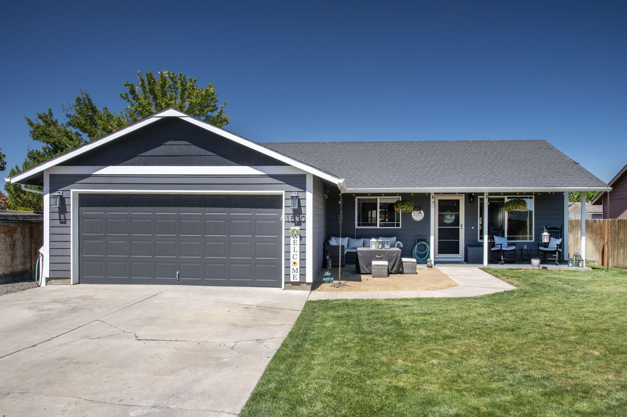 This charming 3 bed, 2 bath home is move in ready. Enjoy the privacy of being tucked away off of the cul de sac, and also having ample parking for all of your toys. Open concept living/dining/kitchen area with vaulted ceilings that provide lots of light. Large front yard and fenced back yard make it perfect for the kids or the pets. Recent updates include: Interior & Exterior paint, flooring throughout, garage shelving, lighting, heating and cooling systems, back deck, and storage shed. 220v power is already plumbed to the outside making it easy for a hot tub or an RV hookup. Great home in a quiet neighborhood.