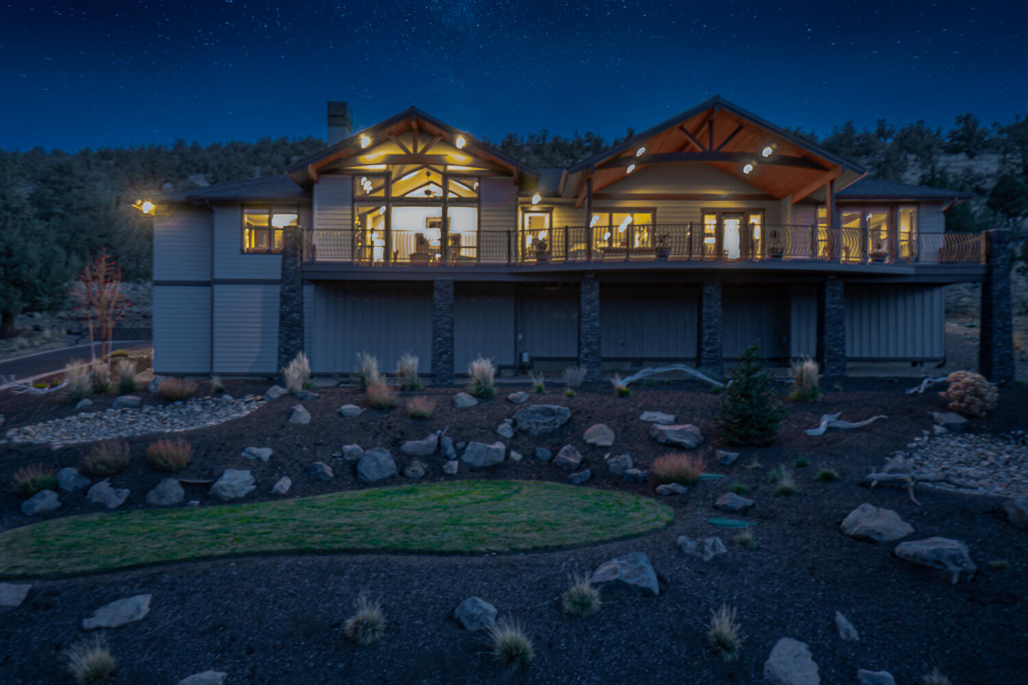 Gorgeous single-level custom home with stunning views of the Cascade Mountains and Smith Rock in Eagle Crest Resort! Built with exceptional craftsmanship and attention to every detail, this incredible home boasts rustic hand-scraped floors, knotty hickory cabinetry, solid core doors, knotty alder-wrapped windows and trim, antiqued slab granite countertops, custom closet built-ins, and power blinds.
The great room features a vaulted ceiling with wood beams, a wall of windows, a stacked stone wood-burning fireplace with gas starter, Ponderosa wrought iron doors, and a custom juniper mantel. Entertainer's dream kitchen with Sub-Zero refrigerator, Dacor 5 burner cooktop and double ovens, 2 Fisher Paykel dishwashers, pull-out shelves, and soft-close drawers.  Large dining room with built-in buffet. Office with built-ins, pocket doors, and deck access. 922 sq ft partially covered deck, insulated four-car garage, and storage under home.