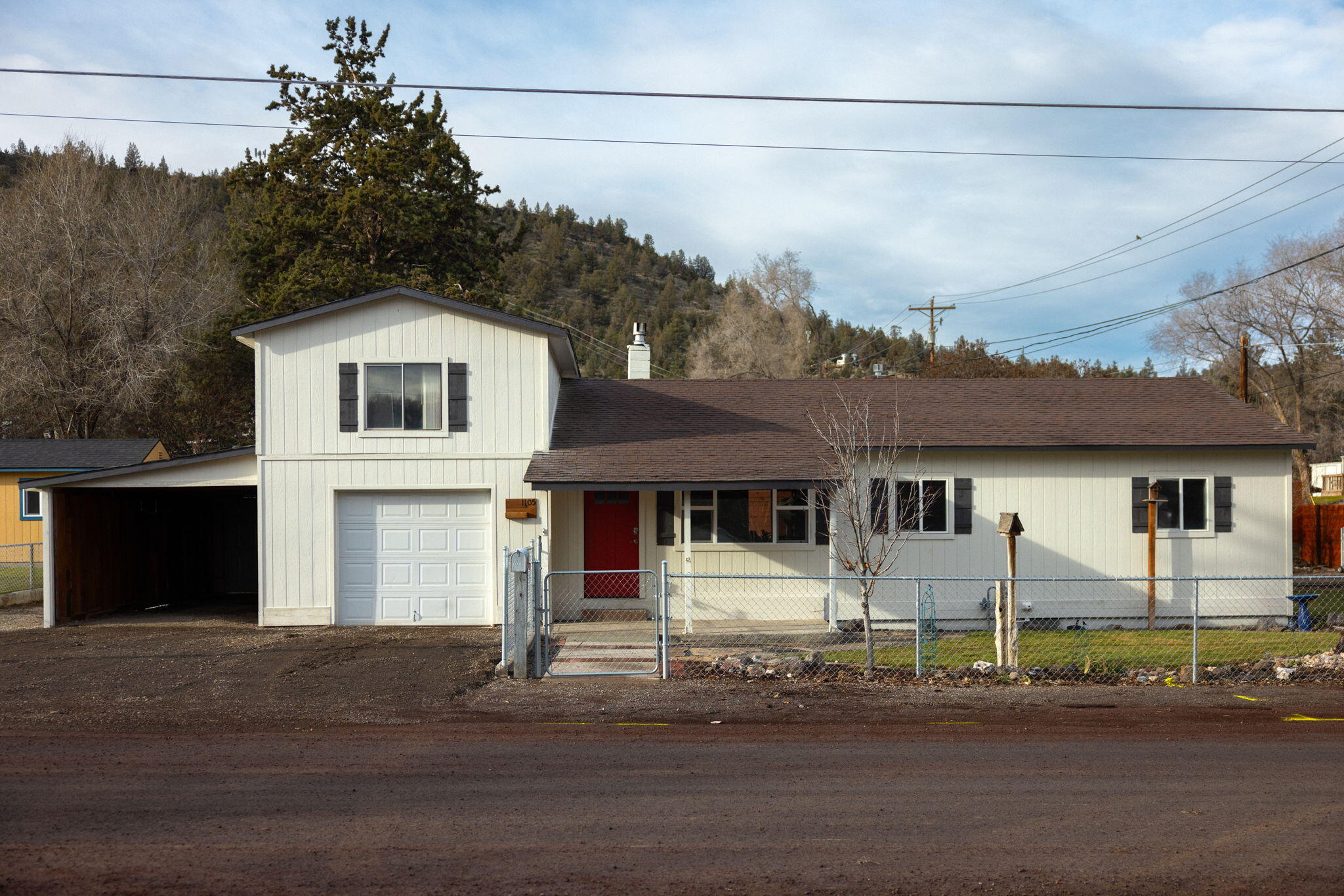 Nestled at the base of the butte is this charming remodeled home. This home is conveniently located next to Meadow Lakes Golf Course and just down the road from Rimrock & Crooked River Park and endless trails. This beautifully remodeled home sits on a corner lot and is fully fenced with RV parking, a covered patio, plenty of storage in the sheds and more. Above the garage you'll find an unfinished space with endless possibilities. Don't miss out on this opportunity! Seller is offering a $10,000 credit at close of escrow and home is being sold as-is.