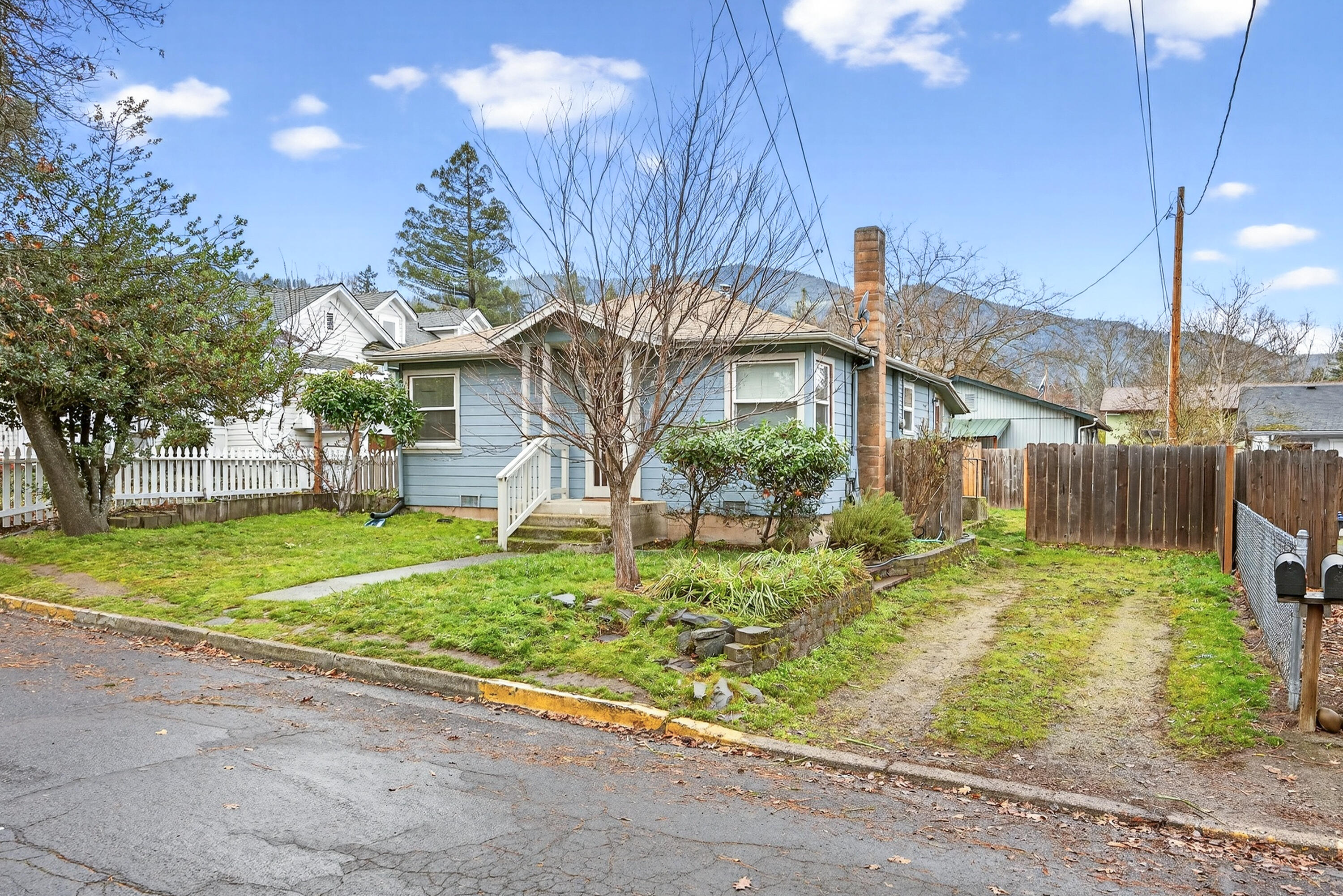 Two separate homes on one flat lot.  303 Garfield is a 3 bedroom 1 bath with 825 Square Feet per Assessor.  307 Garfield is 2 bedroom, 1 bath with 816 square feet per Assessor.  A fence separates the homes for privacy.  303 Garfield is accessed by driveway off Garfield.  307 Garfield is accessed off Wolfard's Alley between Garfield and Palm on Iowa and has own double driveway.  Great location close to downtown Ashland, SOU, Ashland High School and Middle School, Walker Elementary and Garfield Park and Scienceworks.  New sewer line in 2020. Homes have separate meters, separate private yards and own driveways.  303 Garfield was built in 1940's and has the charm of yesteryear with built ins.   307 Garfield was buit in 1977.  303 rents for $1795 and 307 rents for $1500.  Both are month to month tenancy with tenant rights.