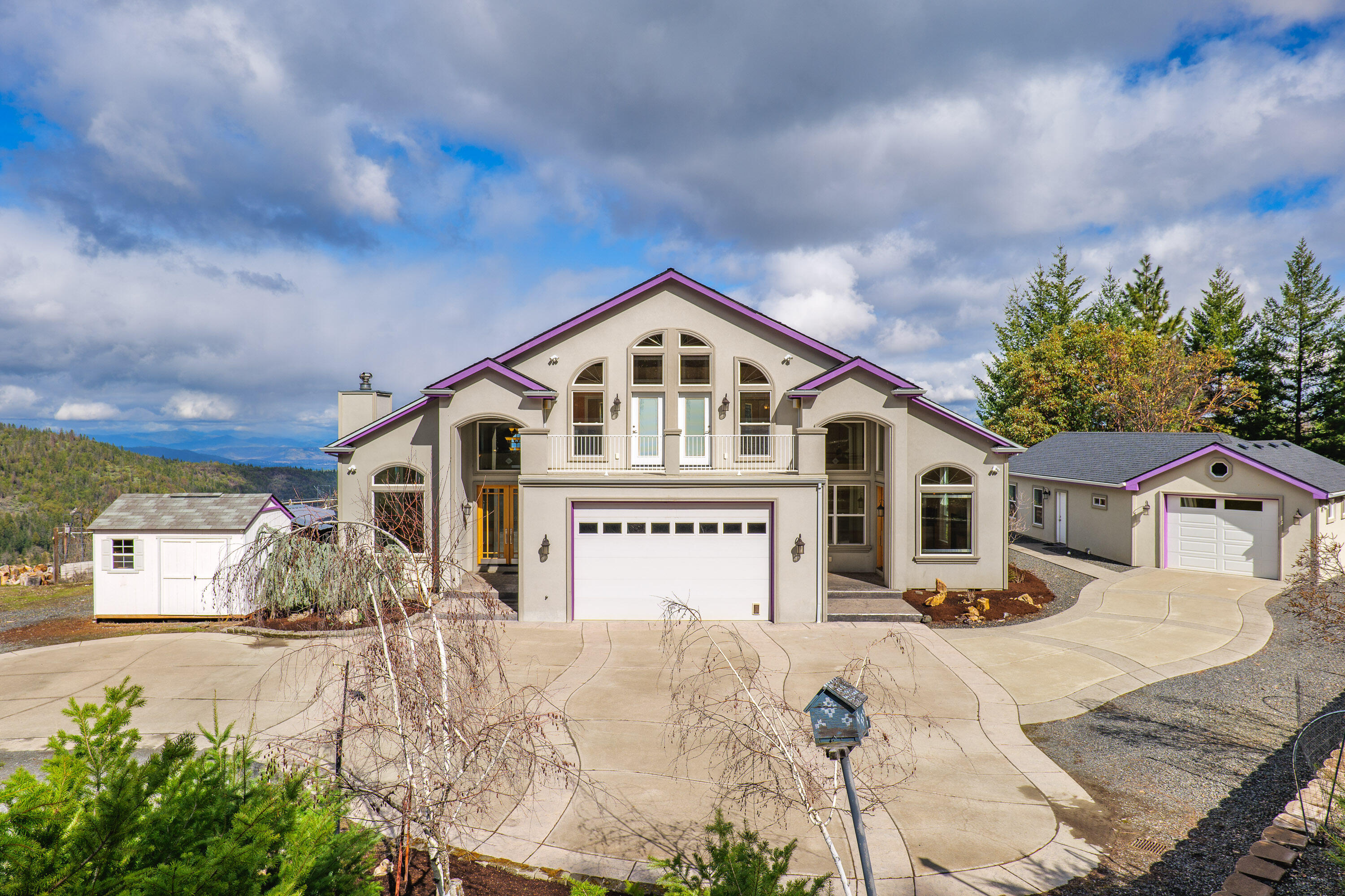 Top-of-the-World Retreat with Breathtaking Valley Views!
This stunning custom 4-bedroom, 4-bath home is a masterpiece of craftsmanship and design. Featuring two master suites, the lower-level suite offers a wet bar, gas fireplace, and private entrance, perfect for multi-generational living or guest quarters. Upstairs, the primary master suite connects to a unique loft with a gorgeous spiral staircase crafted by a local artist while each upstairs bedroom boasts its own private balcony.
Designed to embrace its spectacular surroundings, this home is filled with stunning windows in every room, framing breathtaking panoramic views of the valley and flooding the space with natural light. 
The property also includes a separate finished shop with a half bath, and an attached garage - guest quarters or shop? Outdoors, you'll find raised garden beds, fruit trees, RV parking and the property backs up to BLM. 
This private and peaceful retreat is truly one of a kind - call for a private tour!