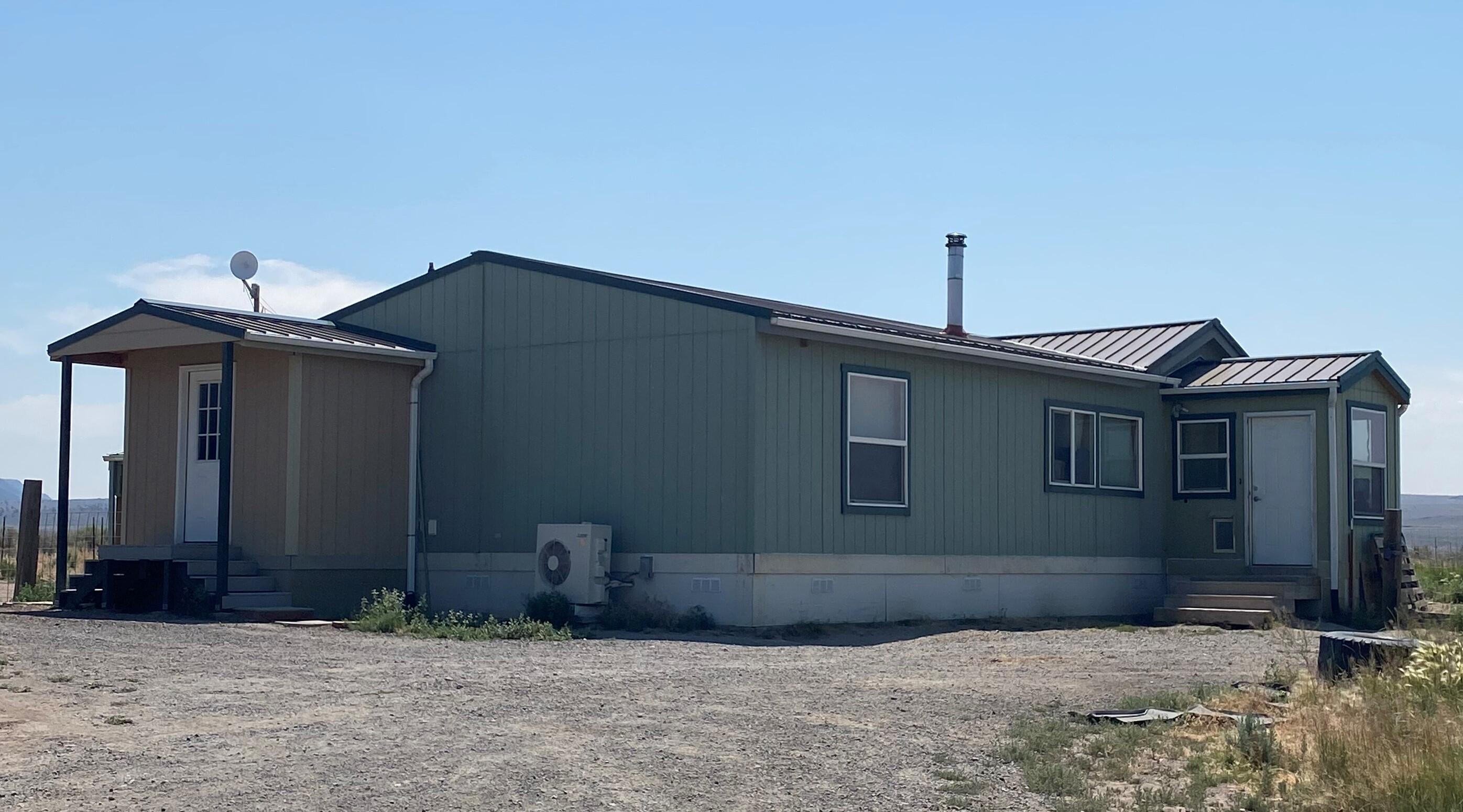 Nice private home on 20 acres set up and ready for all your animals.  This property has several stalls and a heated shop! There are close to two acres of irrigated fields. The house has three enclosed porches, one with a ductless system installed.  Get a close up view of Table Rock right from the front window! Please do not drive onto property without appointment.  Dogs on Property