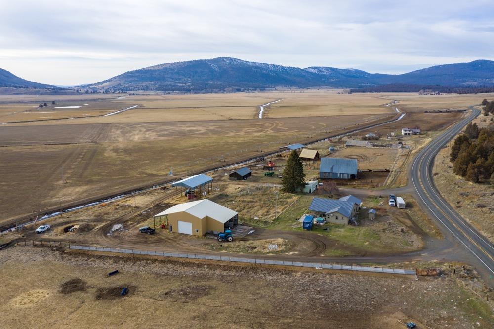 Introducing the CHAPMAN RANCH. A total of 894 acres with 120 acres in alfalfa, 160 acres in grass and the balance in pasture. Five pivots for irrigation; 578 acres of KID water, 110 acres of KBID water and 148 acres of Poe Valley Irrigation District water. Fully fenced and cross fenced. East and west boundary fences are brand new 7 strand barbed wire. North and south boundary fences are 5 strand barbed wire. 98% of cross fencing is electric and set up for pivot crossing so you don't have to open and close gates! Cattle handling equipment includes a 500 head concrete bunk feed yard, a full hydraulic Silencer system (including remote operation) and a 15,000 lb Powell scale. Load out chutes are set up for semis or stock trailers. 500 ton hay storage under 2 pole barns, 50 ton covered grain storage, 40x80 concrete floor shop with 16' roll up door & covered equipment bay outside. Main house built in 2011 is 1580 sqft, 2nd house built in 1979 is 2306 sqft; 2 additional homesites on property.