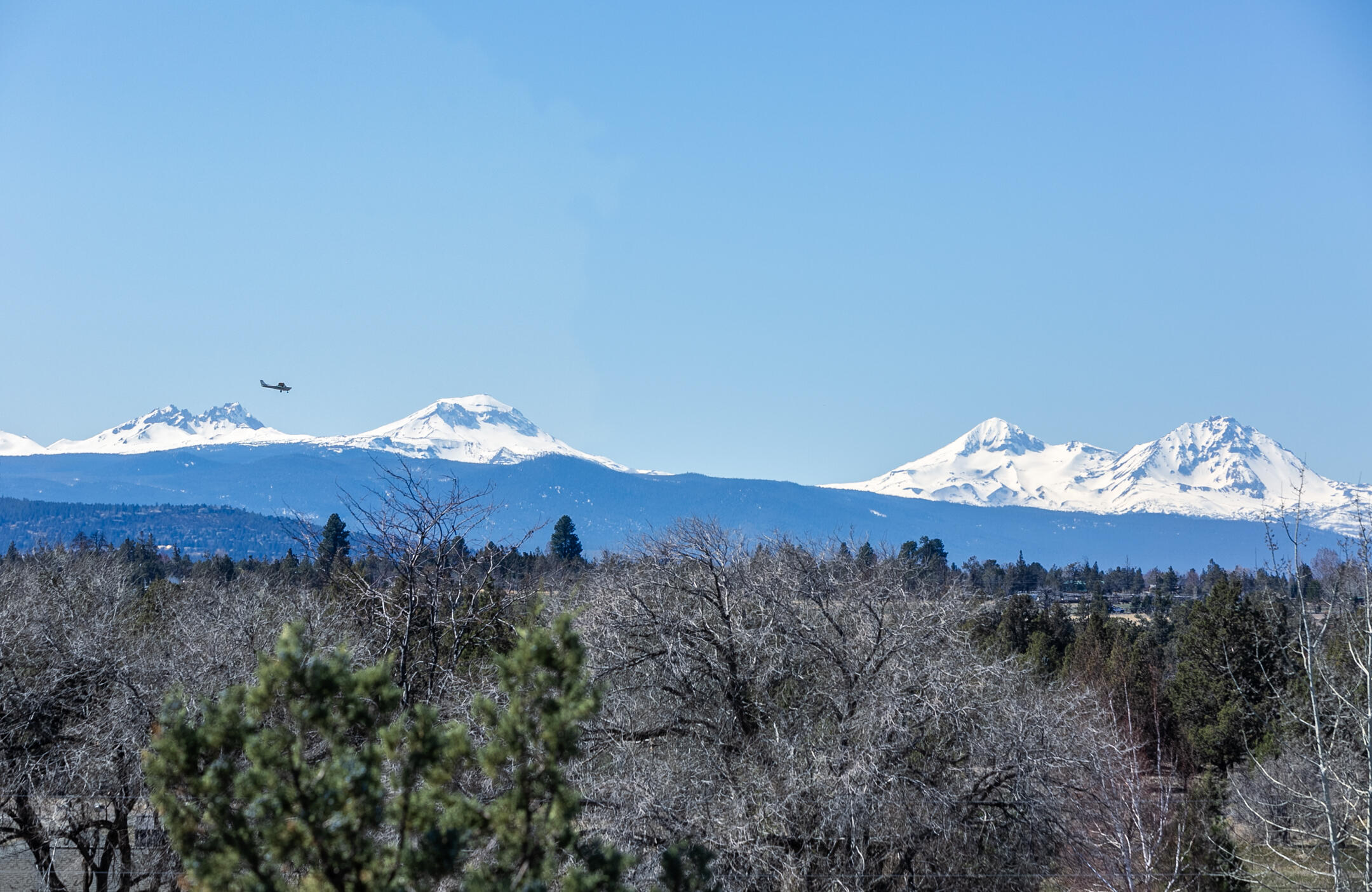 Exceptionally private setting with a brand new, non-shared well - this quality built single level home is full of rustic charm & character. Home was ahead of its time with a huge kitchen complete with large island & central vac too. The privacy of this 10 acres is hard to find, especially close to Bend. With a little tree trimming, the panoramic Cascade Mountain views can be opened up & enjoyed from your front porch or living room. As you walk through the home you will be greeted by large rooms & wonderful floor plan - 3 bedrooms, 2 baths, office, living room, formal dining, dining area & family room with a blazing central wood stove to warm the entire home. The parcel has 5 acres of near hassle-free flood irrigation. With the smell of juniper & the lava rock outcroppings, you have quintessential Central Oregon. Hundreds of acres of adjacent BLM at your backdoor to ride, hike and enjoy! Bring your animals & personal touch & make this beautiful home yours today.