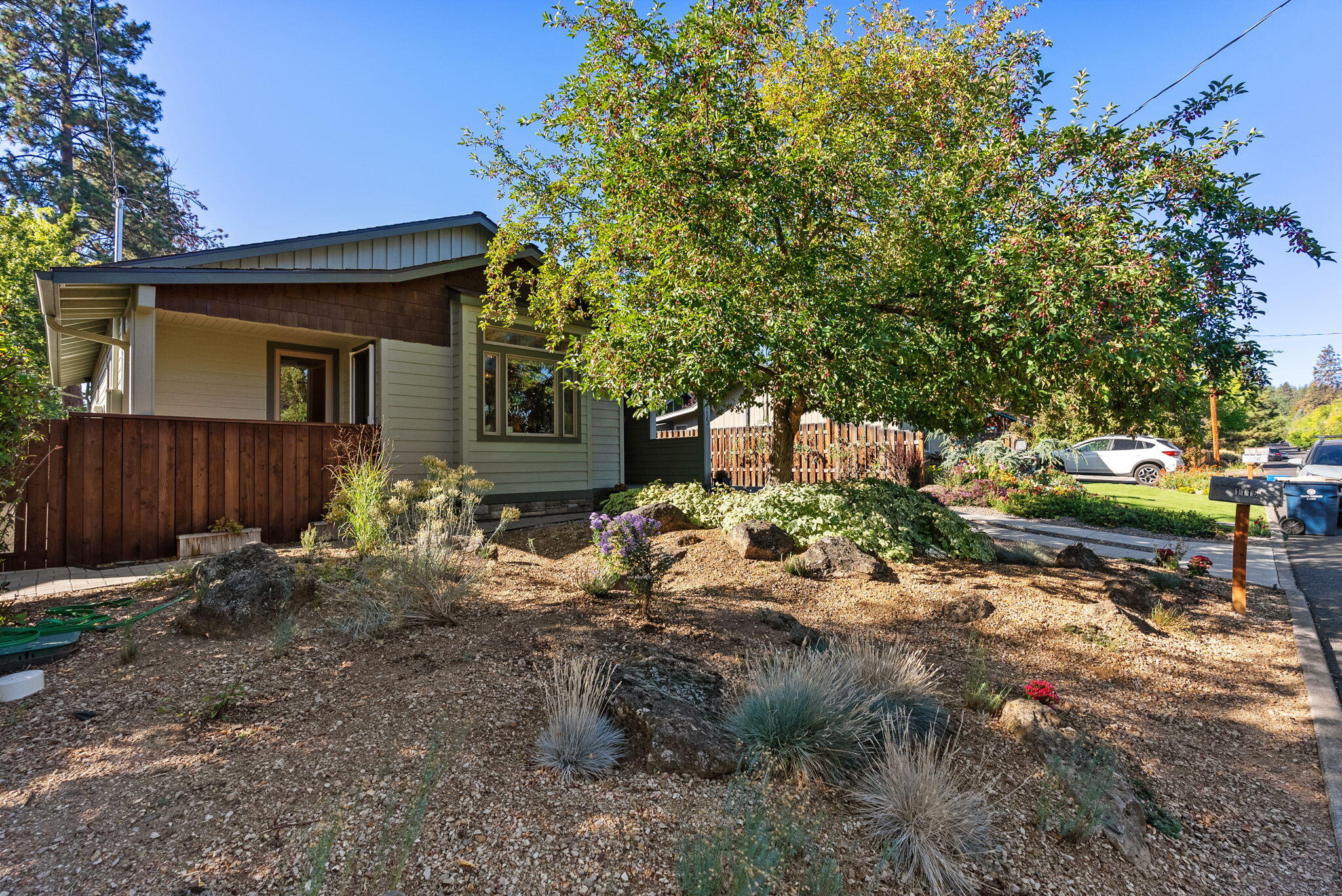 Located in one of Bend's most iconic neighborhoods, this home on Baltimore Avenue is perfectly situated in the very heart of historic Bend. From here, you'll find Columbia Park and the Deschutes River one short block away, while the amphitheater and Old Mill District are just a couple of blocks further on. This newer 2016 home offers an open great room floor plan that features vaulted ceilings, multiple skylights and ample room to gather around the cozy gas fireplace. The generously sized kitchen includes a center island, five burner gas cooktop, a mix of open shelves and enclosed cabinetry and a custom painted tile backsplash. With a full ensuite bedroom on both the main and second levels, a fully fenced backyard, oversized garage & a large, usable basement, this home is loaded with amenities. And, the exceptional, central location provides unbeatable access to the vibrant Galveston and Century Drive corridors as well as Drake Park and downtown Bend. Don't miss it!