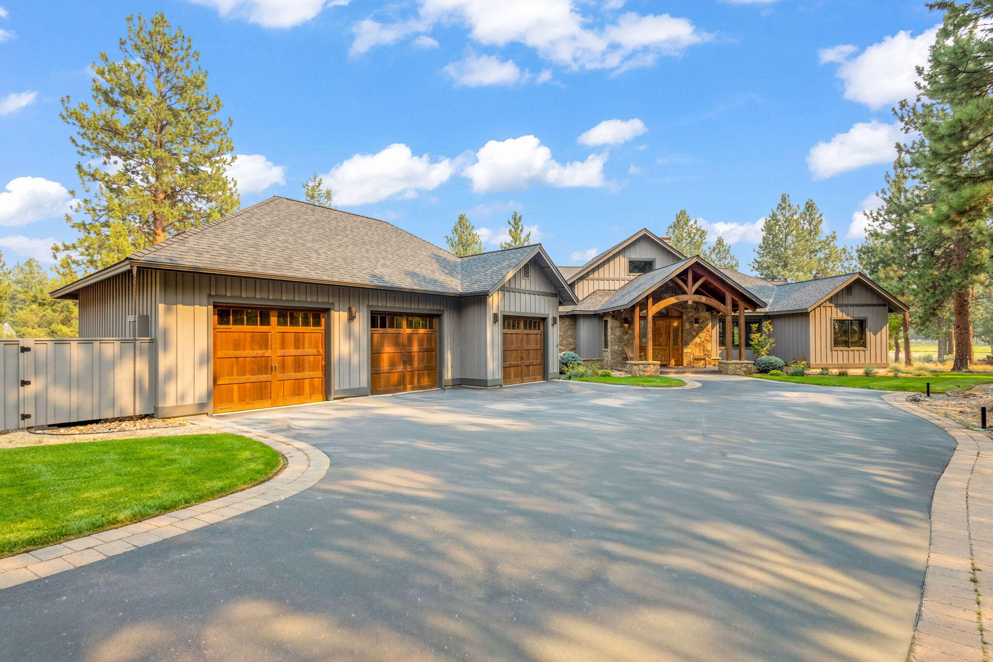 Northwest lodge-style single level home with lake frontage at Aspen Lakes Golf Estates. Interior features: Large great room with high vaulted ceilings, beam work, floor to ceiling rock fireplace, huge windows and a big view of the lake; True ''entertainers'' kitchen with enormous island, double oven, 6 burner cooktop, large pantry, and an abundance of storage space; Large primary bedroom with 2 walk-in closets, walk-in shower, double vanity, private toilet; Two additional en-suites at opposite end of the home; Office/sitting room; Wood style tile, solid wood doors, and casework throughout; 10' plate height where non vaulted; 8' x 14' lap pool; Oversized laundry room. Exterior features: 1183sf garage with 3 garage doors, mechanical room, additional workroom and extended length at one end; Huge paver patio with outdoor fireplace in the rear of home with covered roof. Property owners enjoy access to the community clubhouse with an exercise room, outdoor pool, hot tub, and tennis courts.