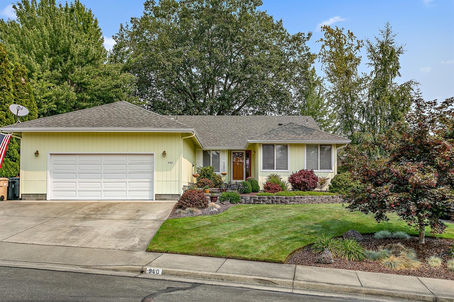 Beautiful home in NW Grants Pass has all the amenities you've been searching for. Featuring an immaculate 3 bedroom, 2 bath home with 1951 sf. The cook will love this kitchen with tile counters and floors, 5 burner natural gas stove, pantry, newer appliances, snack bar, and nook. Sunny and bright living room with formal dining. Great room has vaulted ceiling, free standing gas stove and slider to the patio. Spacious master suite vaulted 14 ft. ceiling, plant shelves, large walk-in closet, dual sinks, tile counter and shower and slider to the patio. Beautiful wood floors, skylight, newer roof and HVAC system. Laundry room with utility tub and cabinets. An attached two car finished garage with shelving. Low maintenance .19 of an acre in a cul-de-sac location. Convenient to schools, shopping and hospital. District 7 schools.