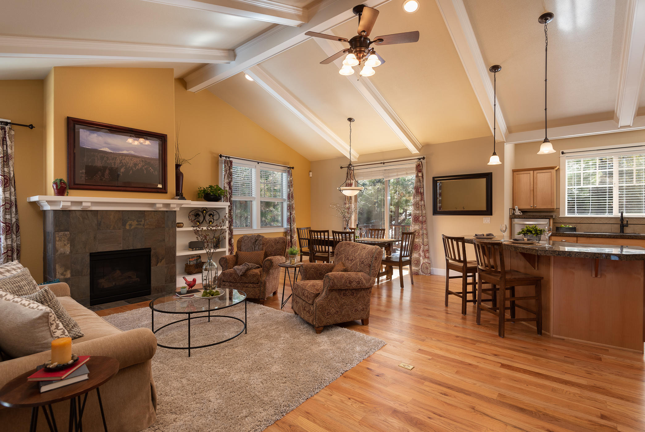 Charming NW Craftsman Chalet loaded with fine finishes and quality upgrades. Spacious Great Room features vaulted ceilings, beautiful hardwood flooring and cozy gas fireplace. An entertainer's delight with open-concept kitchen, large center island and granite tile countertops. Master retreat features a luxurious ensuite bath, second gas fireplace, balcony and flex space that could be used as a home gym, office, nursery, hobby room or sitting area. One of the secondary bedrooms includes a desk and cabinet built-ins for a move-in ready office experience, complete with a sliding-glass door that leads to the lush outdoor garden area featuring two decks. Located at the base of Mt. Bachelor, with an extensive trail system out your front door, in the highly coveted Braeburn neighborhood, this spacious retreat is the perfect home base for all your Bend adventures!