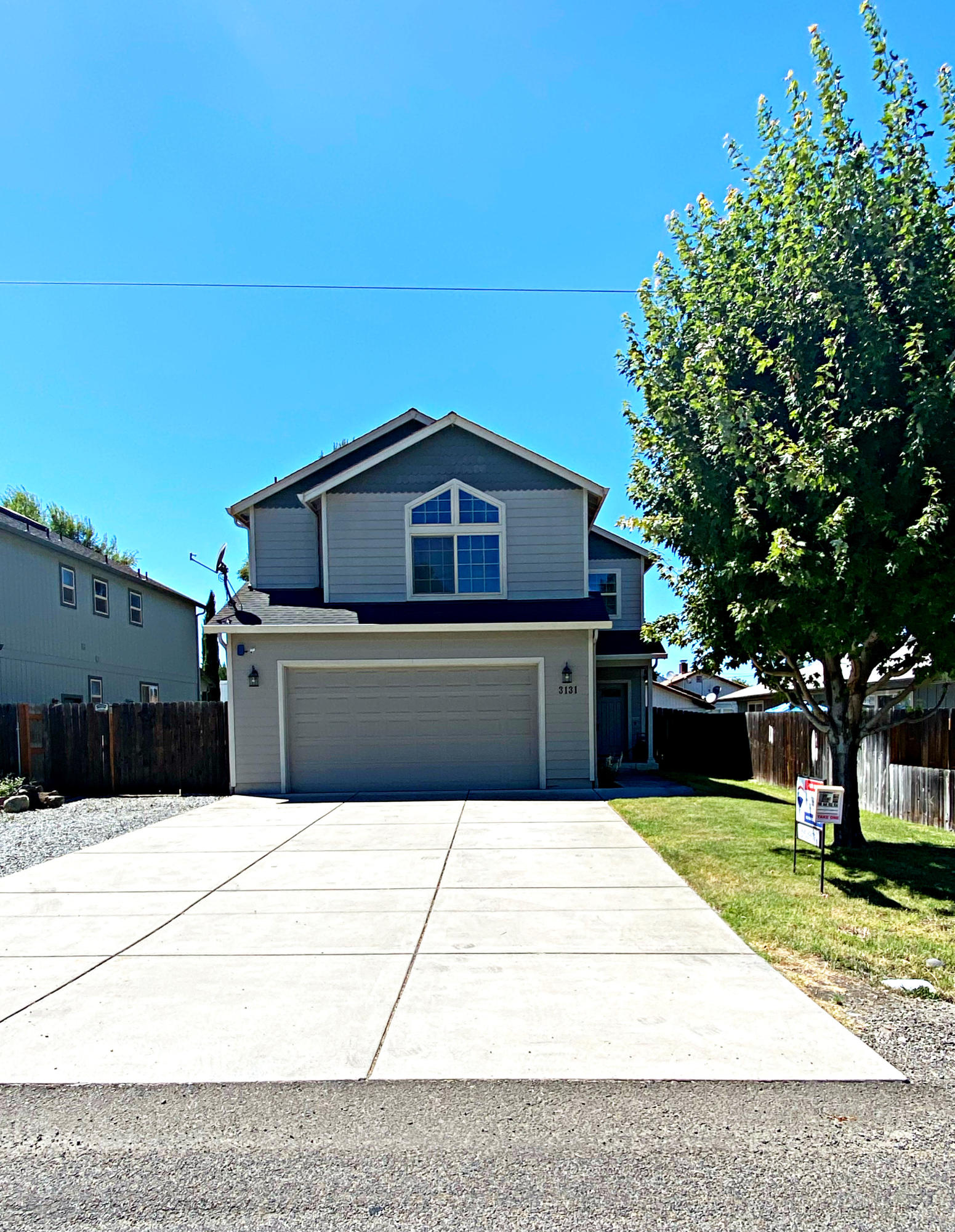 Updated two-story home on the border of Central Point and Medford! Enjoy three bedrooms with two and half baths in 1994 square feet. Newer maple hardwood floors. The living area is open and bright with a cozy gas fireplace. The kitchen has all newer appliances including dishwasher, gas range, microwave and even a custom refrigerator! There's also a convenient eat-at bar. All Bedrooms are upstairs and have carpet along with a spacious Master Suite with a huge walk-in closet and well-appointed master bath. The upper level offers a split floor plan with a separate office or perhaps a 4th bedroom, but the 4th bedroom does not have a closet. The laundry room is conveniently located upstairs. Dual heat/ac units for each level. Outside, you'll find covered patio and RV parking for a small boat or trailer.  Ario Security System included.