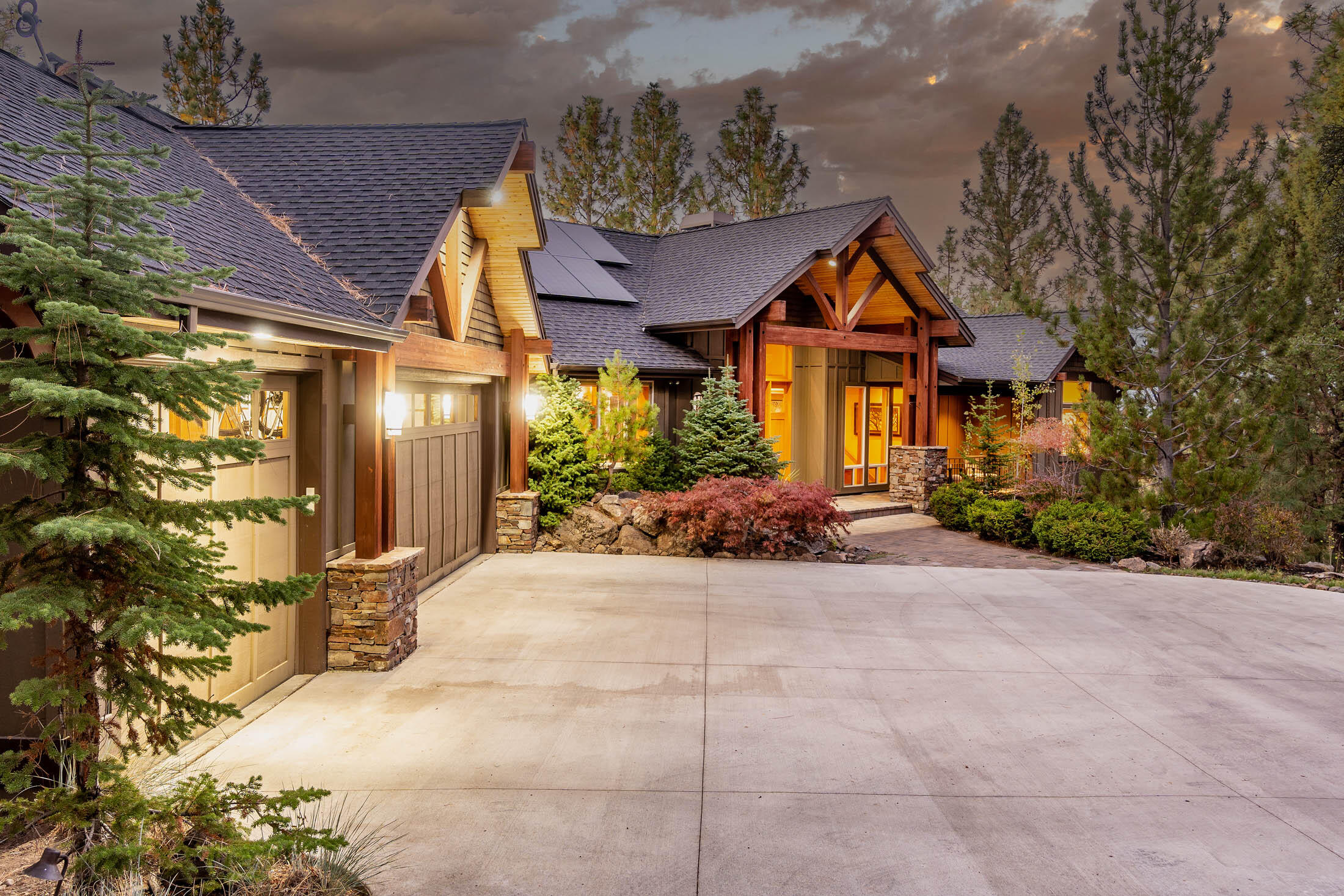 This very private executive home exudes the timeless Northwest architecture of Norman Building & Design. Perched on coveted Awbrey Butte, an impressive entry greets you w/ a massive prow, paver patio, trickling water feature & oversized wood front door.  Once inside the foyer, the stunning great room boasts a grand Chief Joseph rock fireplace, vaulted cedar ceiling, beams, hardwood floors & Cascade Mountain views.  Chefs love the kitchen, commercial refrigerator, Dacor ovens & 5-burner gas cooktop, island, dining room & a sizable deck, perfect for entertaining.  A main floor office, laundry & primary bedroom, en-suite bath includes jetted soaking tub, double vanity, enclosed toilet & generous walk-in closet.  Lower level enjoys a family room, 4 bedrooms, 2 baths & access to a private patio to enjoy the .87 acre lot, immaculate landscaping & 2nd water feature.   A new automated heated driveway, solar panels, 3-car garage wired for electric car charger make this luxury home complete.