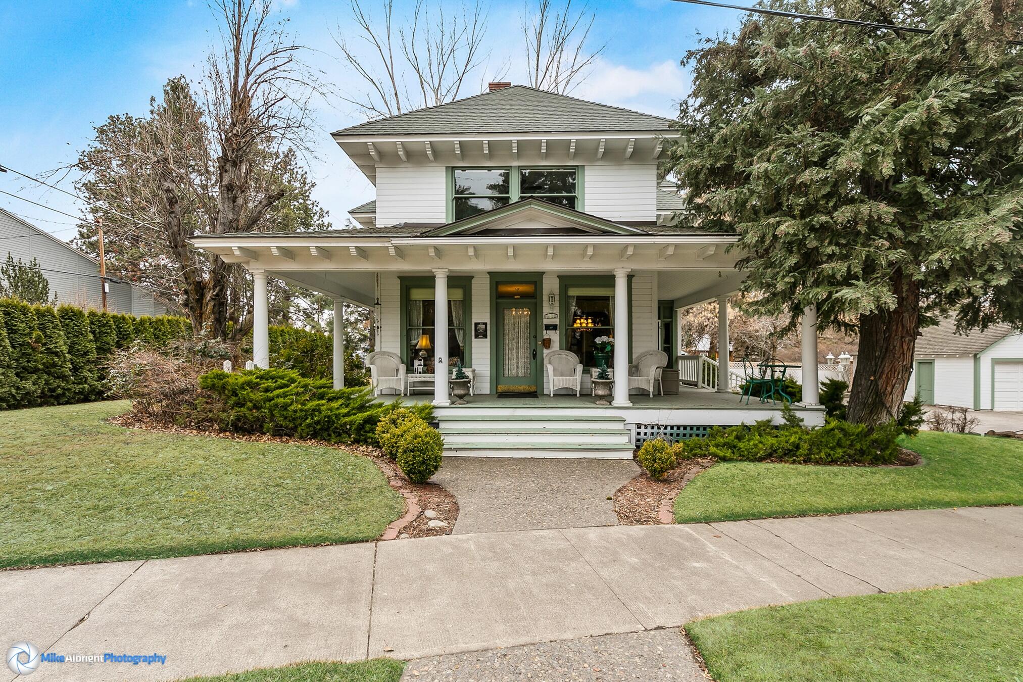 Step back in time as you enter the historic Sather House just blocks from downtown Bend. Added to the National Register of Historic Places on June 27,1997 and home for many years to one of Bend's well-known historic citizens (Evan A. Sather, a prominent business man, civic leader and photographer), this property has maintained the beauty and nostalgia of early days. Centrally located between downtown, the Old Mill and Drake Park, this property offers easy access to all of Bend's best and most popular amenities. Used for many years as a favorite Bed & Breakfast this home offers 5 beds, 5 baths, living room, dining room, parlor and sunny eat-in kitchen. Gorgeous original woodwork and hardwood flooring highlight the home's interior. Looking for additional space? Unleash your imagination on the unfinished 832 sq ft basement and huge attic space! The exterior is framed by a welcoming wrap around porch, perfect for watching the world go by on a summer day. This home has been well-loved.