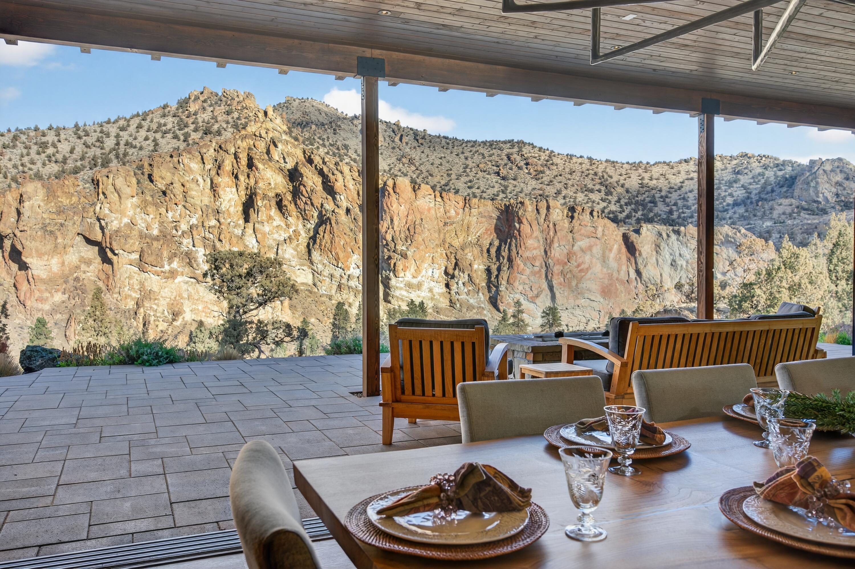 I am Painted Rock.
Nestled w/in the exclusive Ranch at the Canyons, I was created to honor both nature's grandeur & the bonds of family. Cradled by 2.5 miles of private Crooked River frontage, framed by the timeless cliffs of Smith Rock, I offer a sense of peace that few places can match—just 20 minutes from Redmond Airport, yet worlds away in spirit.
I've been home to two families—each one adding to my story, each one cherishing my views, my quiet mornings, & my golden sunsets over the canyon. I was designed w/ intention & heart, built to welcome more than one generation at a time. My main level holds two primary suites, each in its own private wing, allowing comfort & independence while still keeping loved ones close.
In my great room, walls of glass open wide to let the high desert light pour in, merging the warmth of my interior w/ the vast beauty beyond. I am a place where privacy meets connection, where laughter echos off canyon walls and Oregon's wild beauty is celebrated.